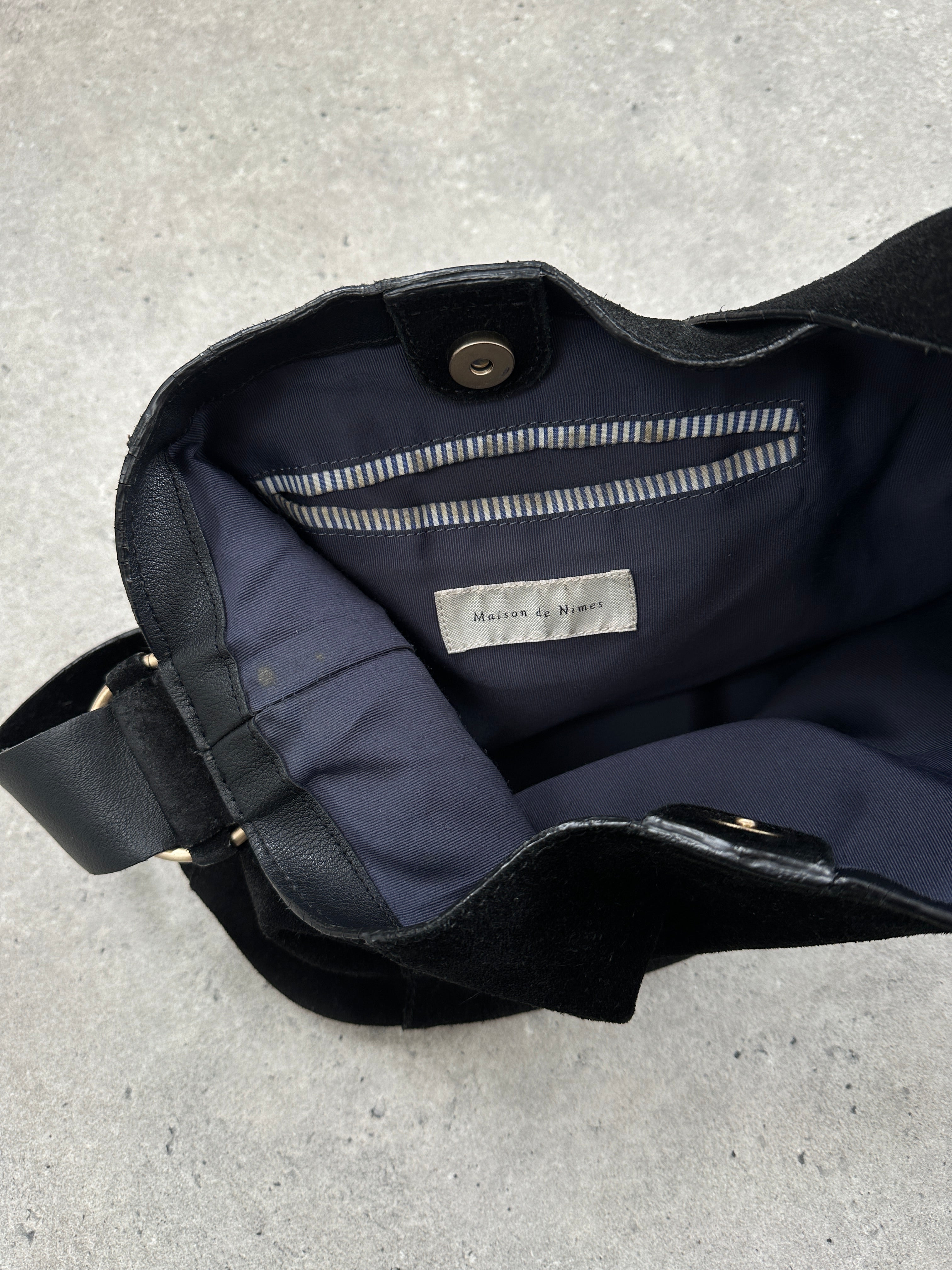 Vintage Maison de Nimes suede bucket bag with adjustable strap and minimalist design, perfect for casual and stylish outfits.