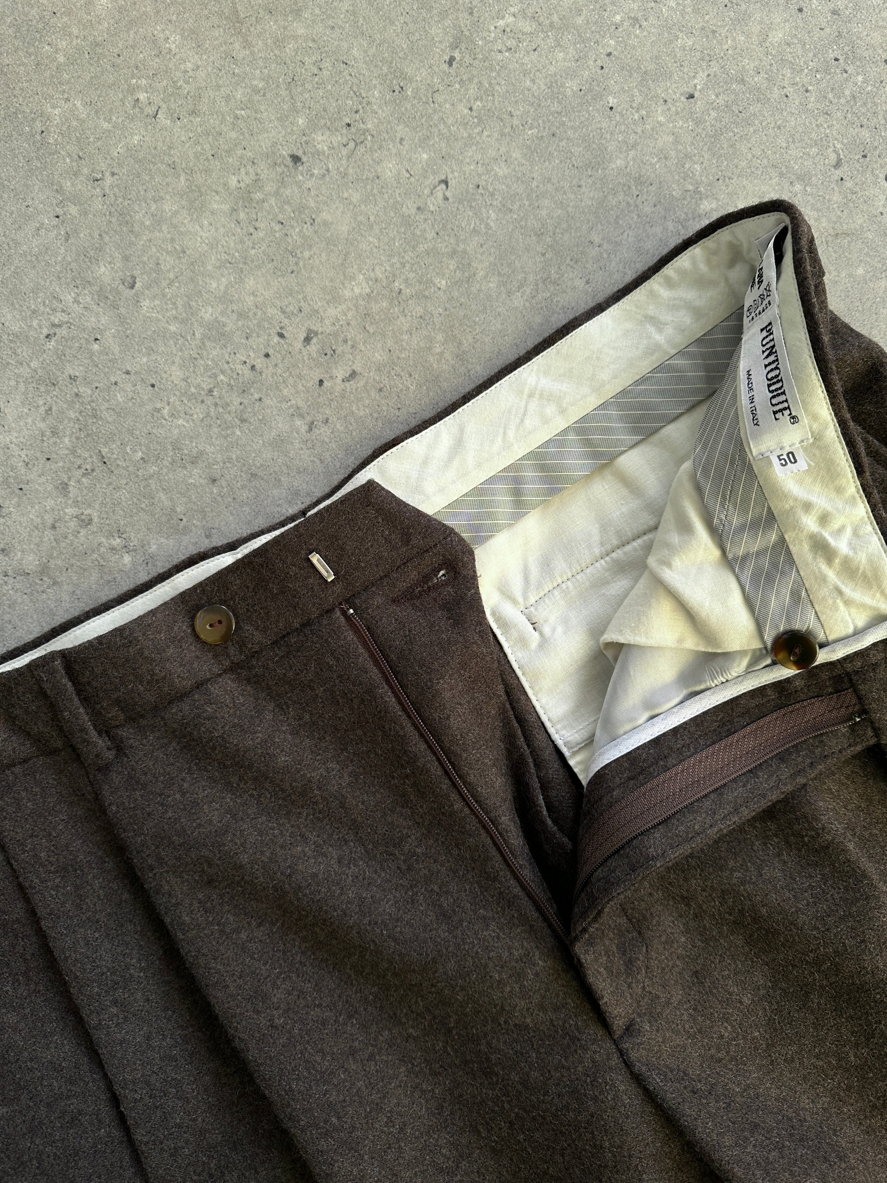 Vintage Italian tailored trousers in pure brushed wool, size W32, showcasing classic fit and textured fabric.