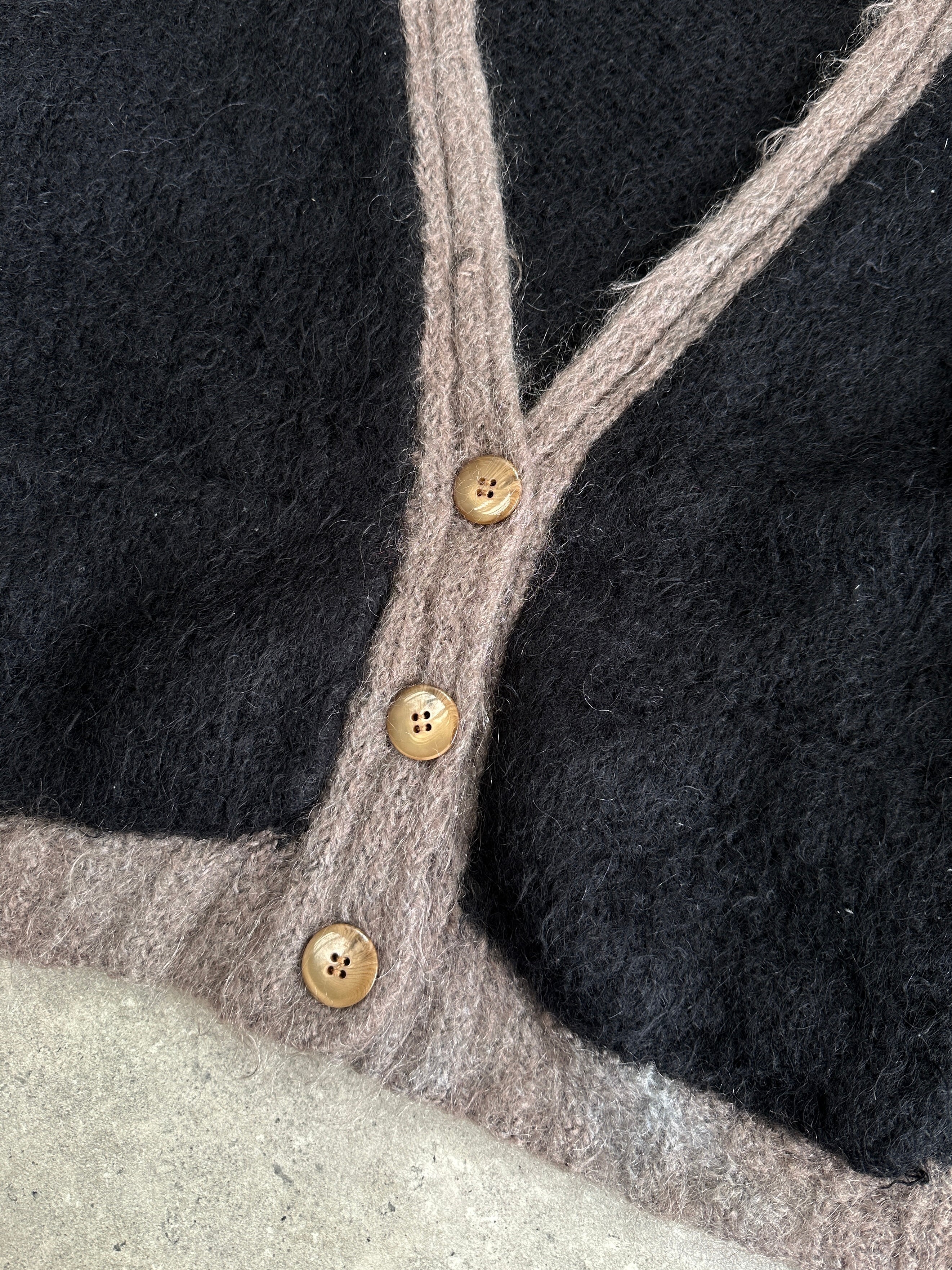 Vintage mohair wool fuzzy cardigan in size large, cozy and textured with a vintage style, featuring a soft, fuzzy appearance.