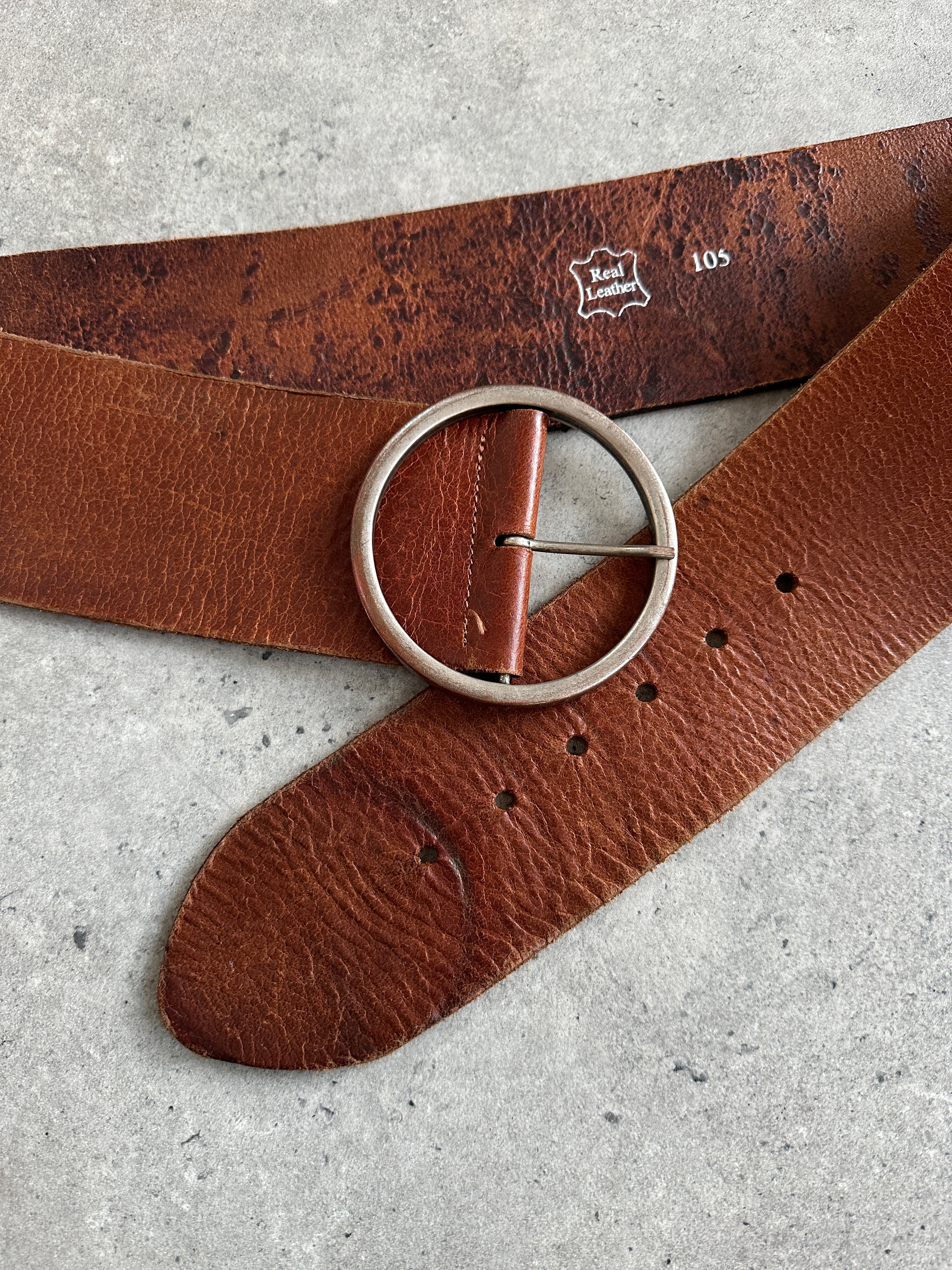 Vintage 1990s round leather chunky belt in natural brown with brass buckle, adjustable W38-42, from Vintage brand.