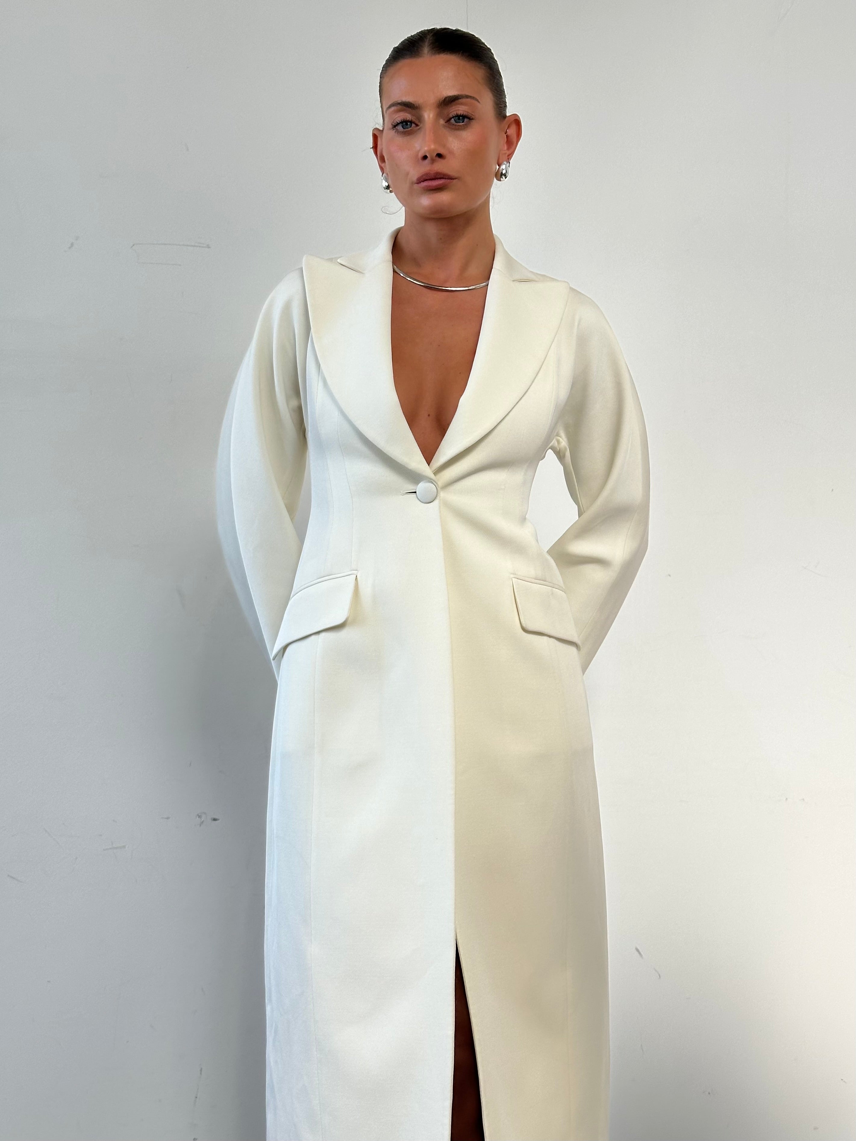 Emporio Armani wool blend fitted coat in size S displayed on a mannequin, featuring a sleek tailored design and classic style.