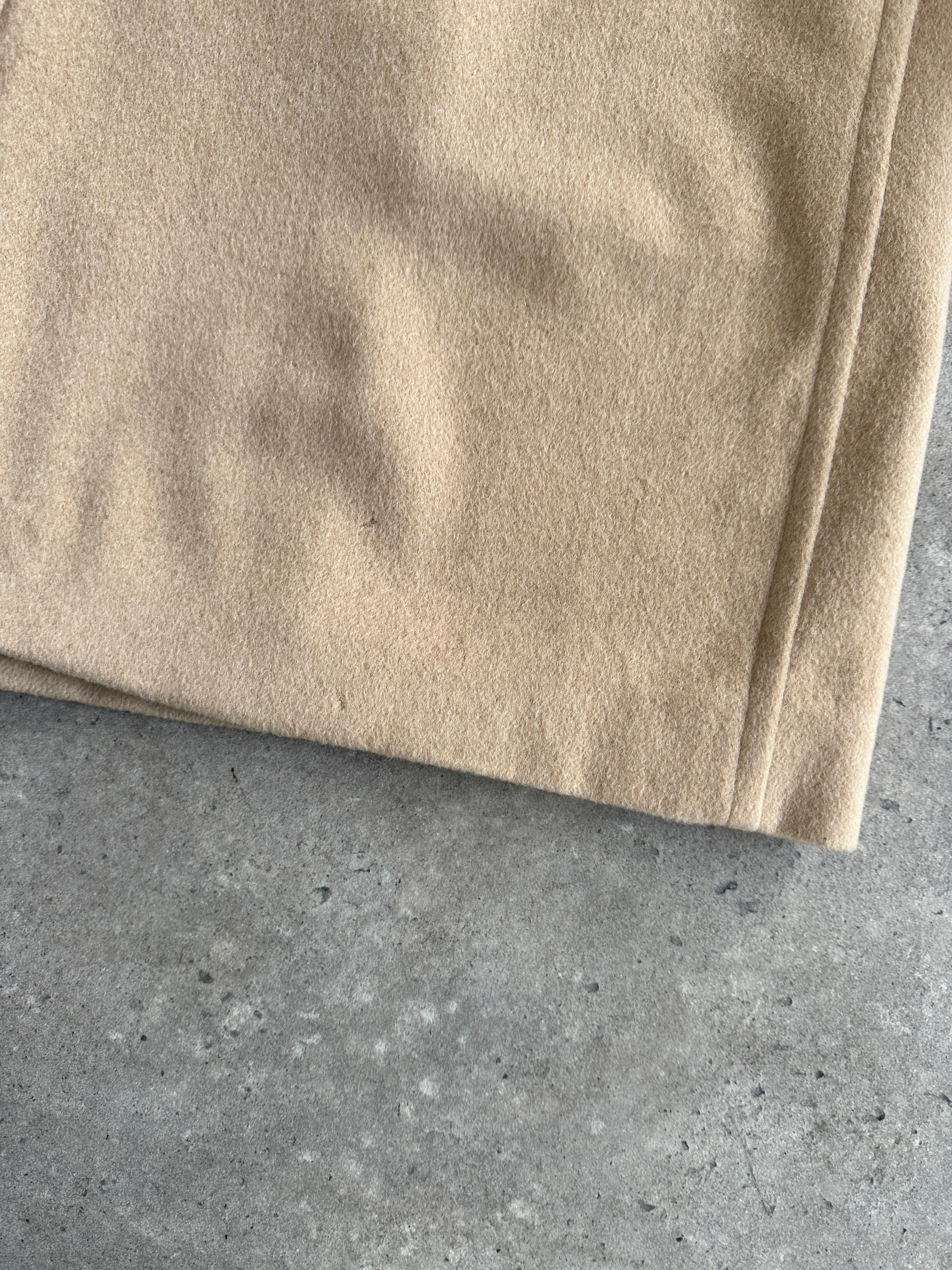 Burberry Pure Cashmere double-faced single-breasted coat in size L, shown on a hanger with a classic beige and black design.
