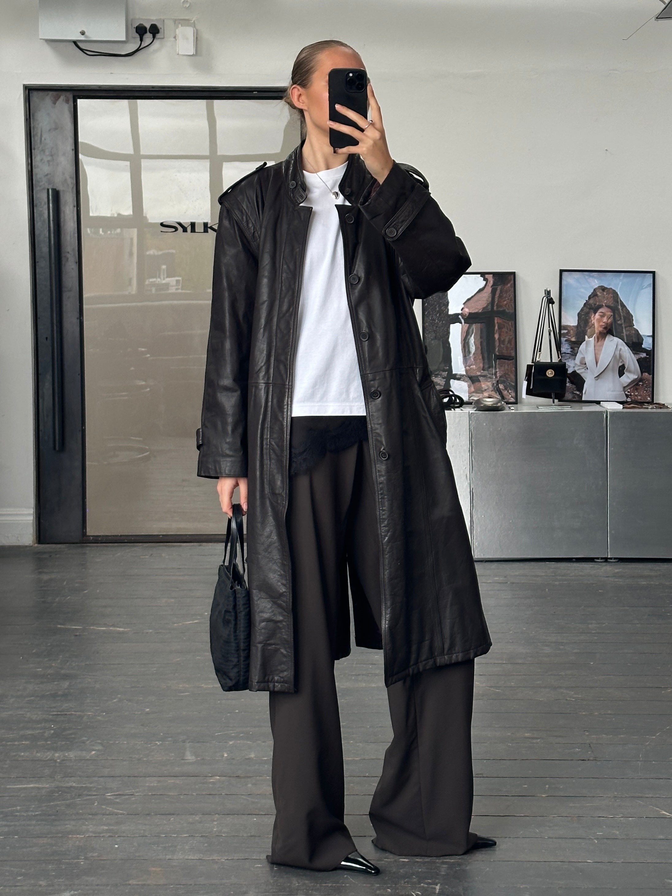Vintage Italian 1990s belted leather trench coat, stylish jacket in size L/XL, featuring classic design and rich leather texture.