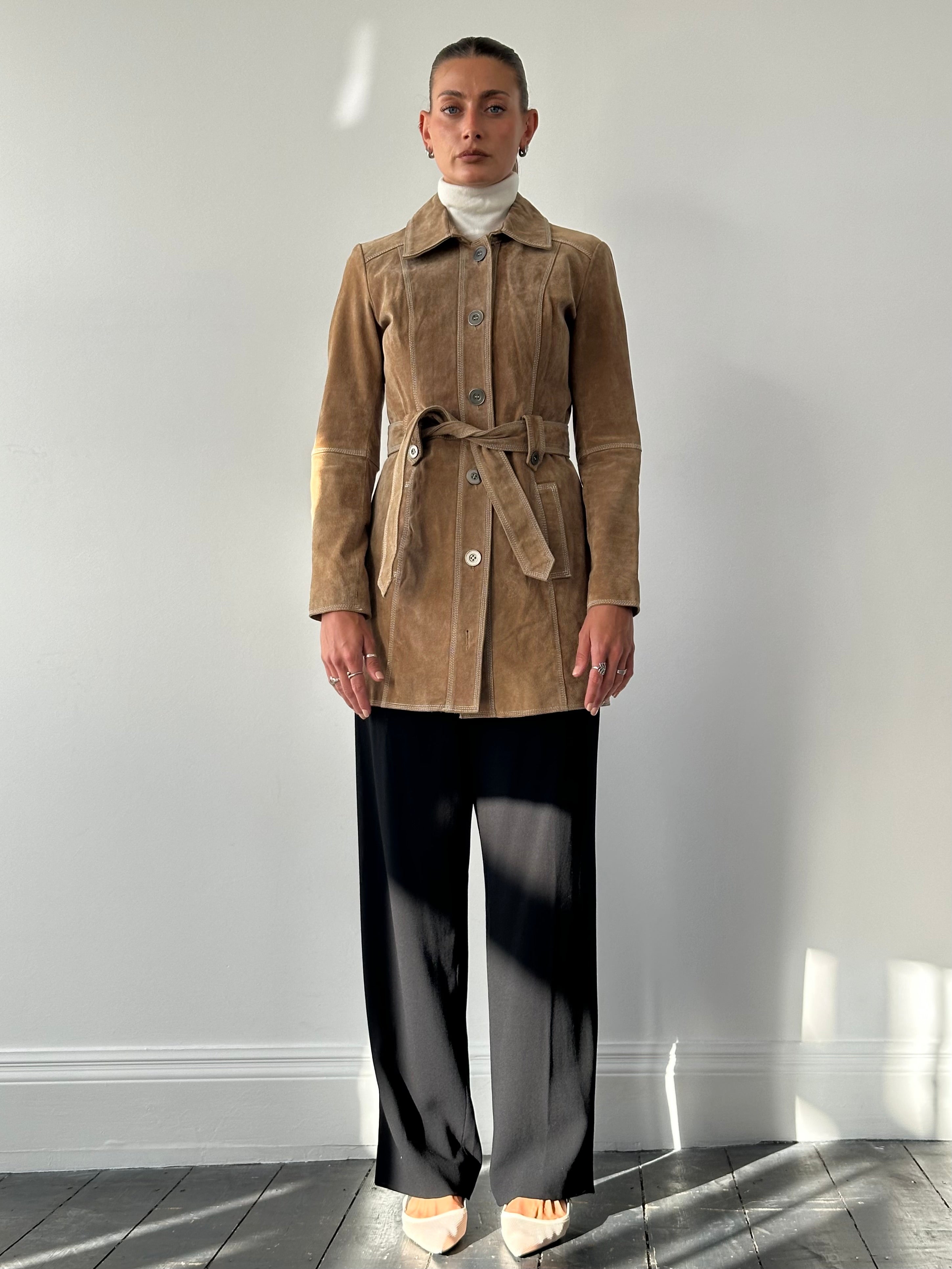 Vintage suede belted jacket in size M, featuring classic design and tailored fit, displayed on a hanger.