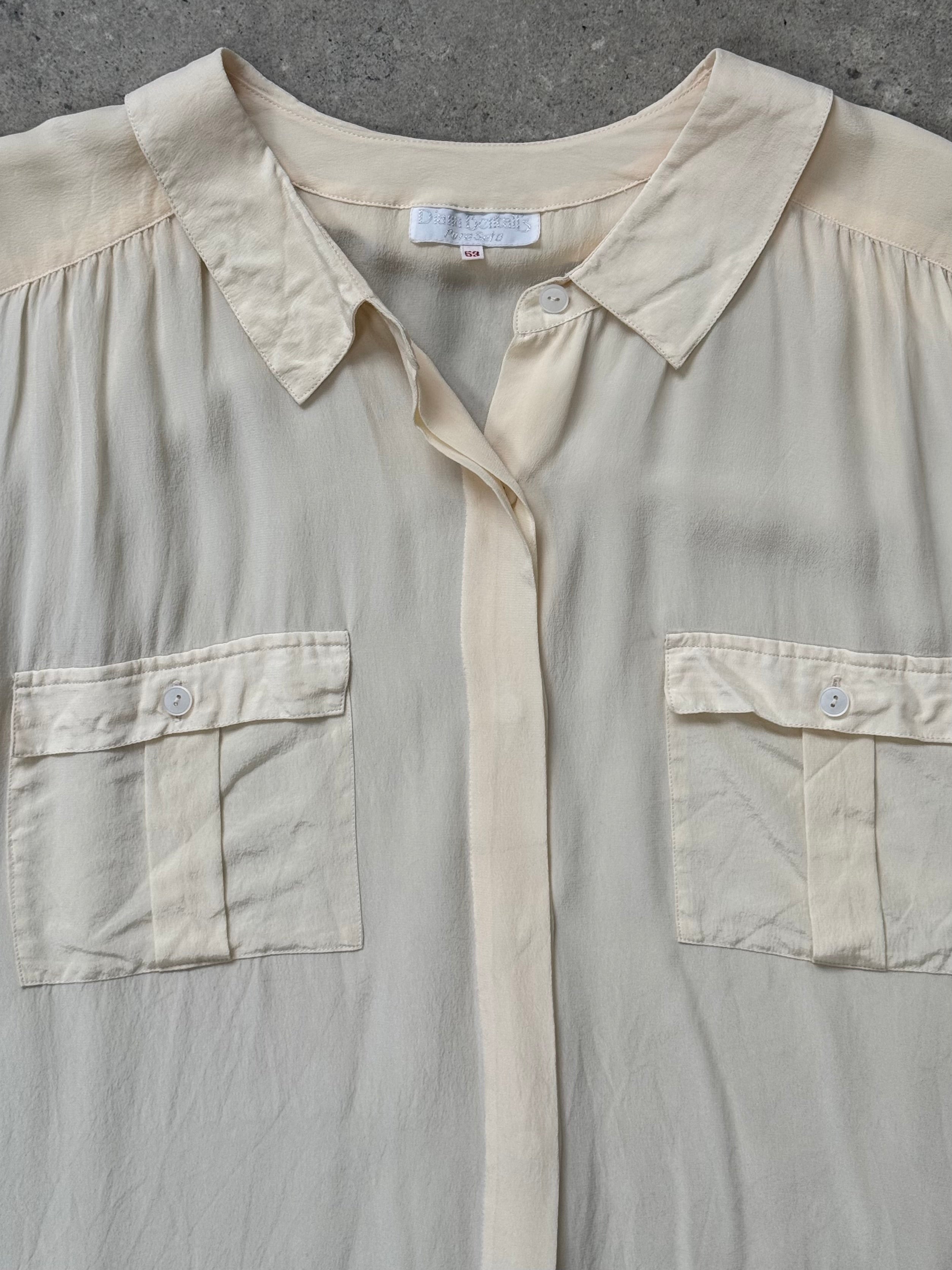 Vintage 1990s pure silk concealed placket shirt in size L/XL, featuring a classic design and elegant fabric.