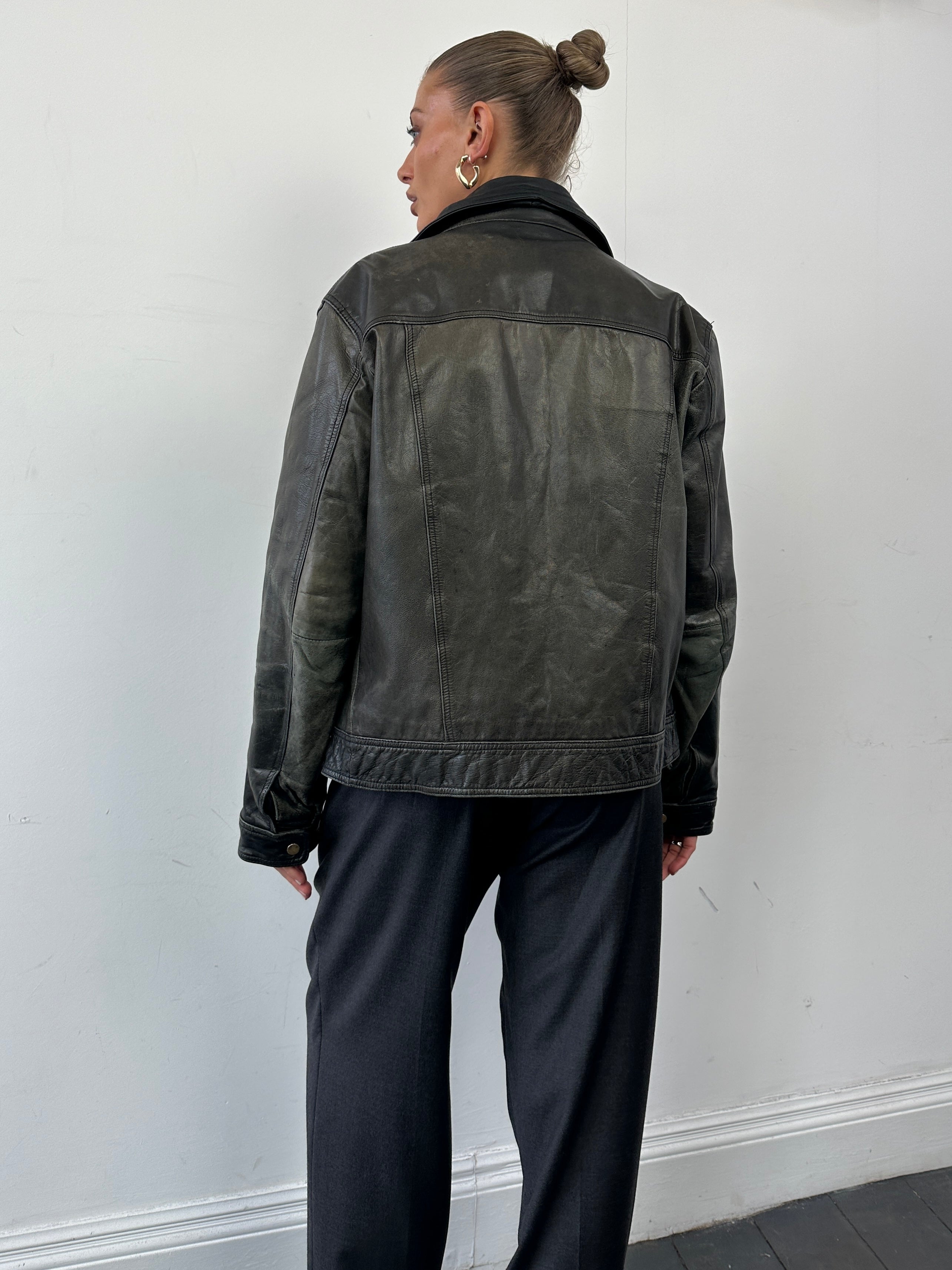 Conbipel distressed leather jacket in size M, featuring a rugged design with worn-in details and classic jacket style.