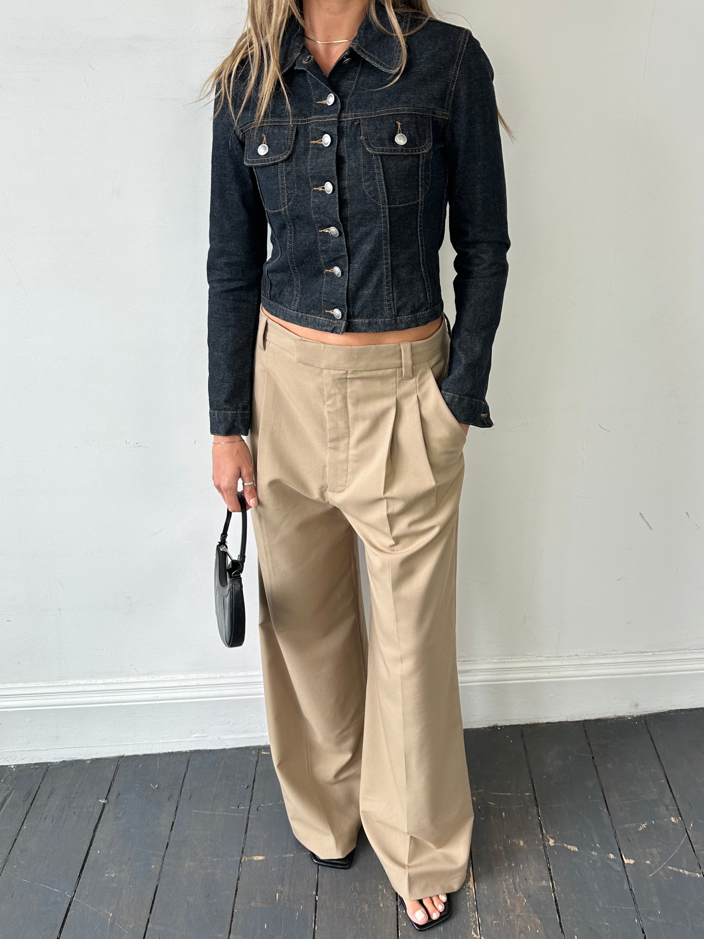 Vintage Italian vintage fitted raw denim jacket in XS/S size, showcasing classic design and distressed denim fabric.