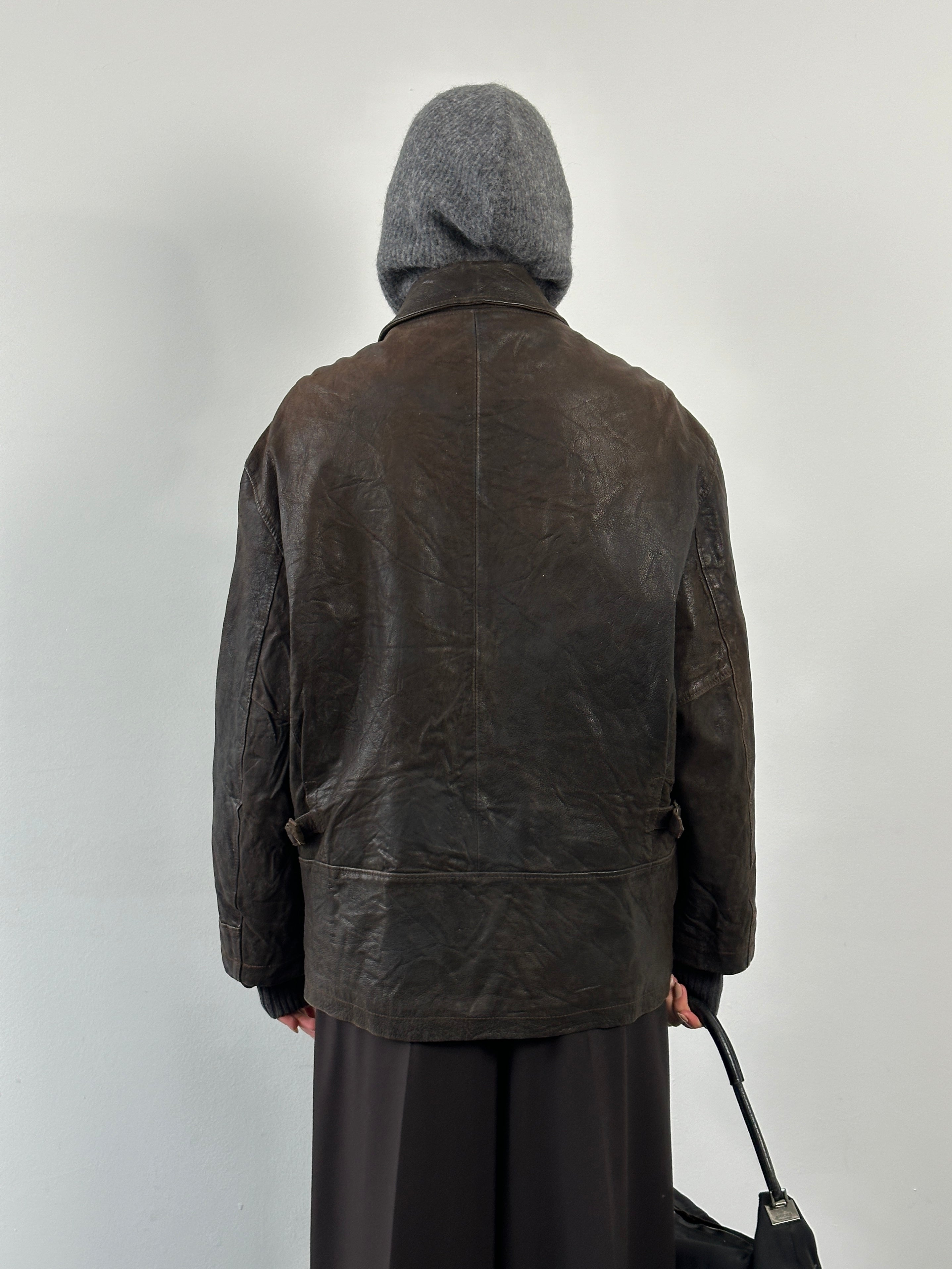 Vintage 1980s leather jacket with concealed placket, size large to extra large, featuring classic vintage style and durable leather material.