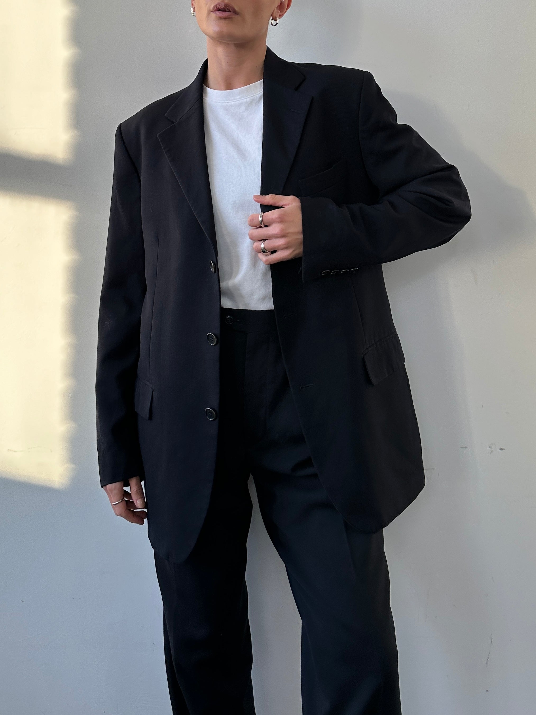 Yves Saint Laurent pure wool single-breasted blazer in black, tailored fit with notch lapels and button closure.