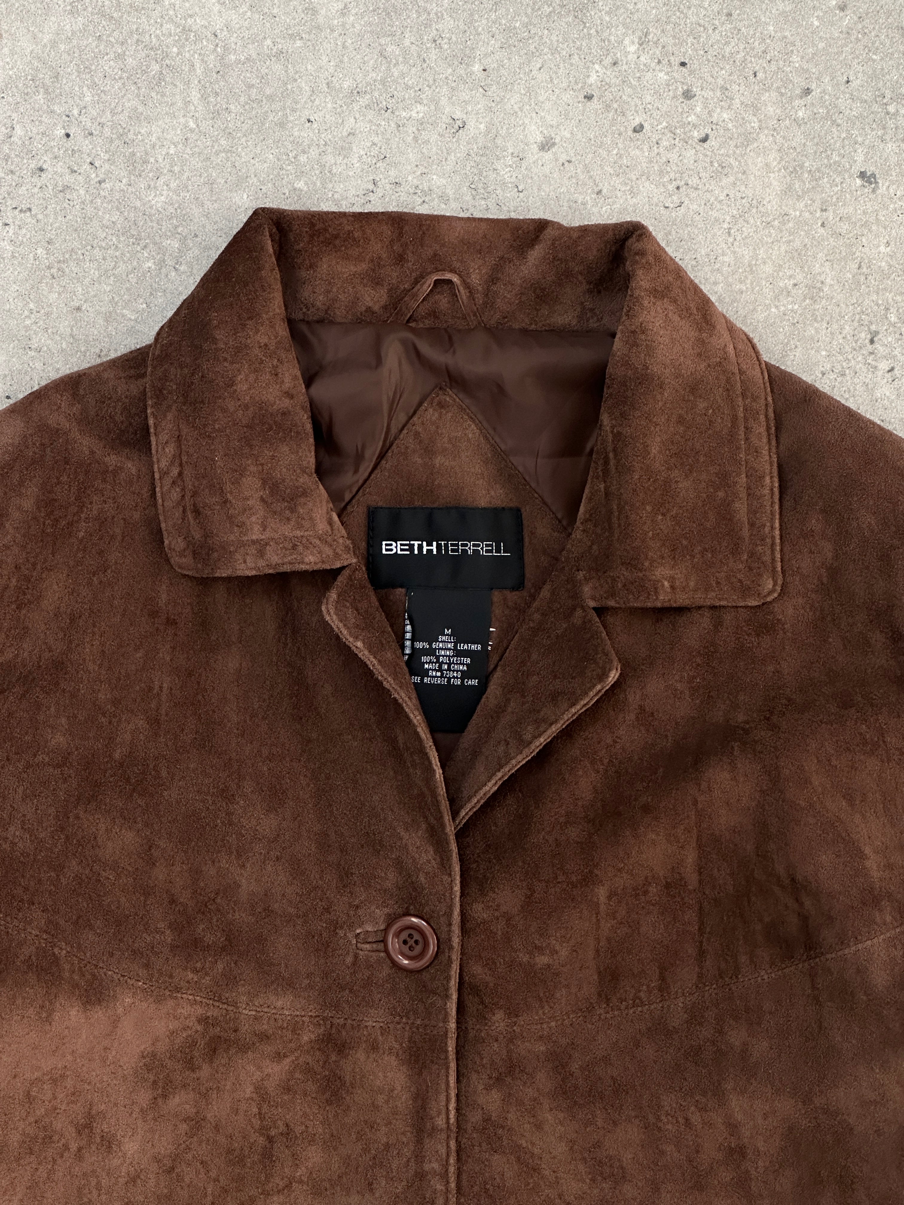 Vintage suede jacket in size large, featuring a classic design with a soft texture and stylish collar.