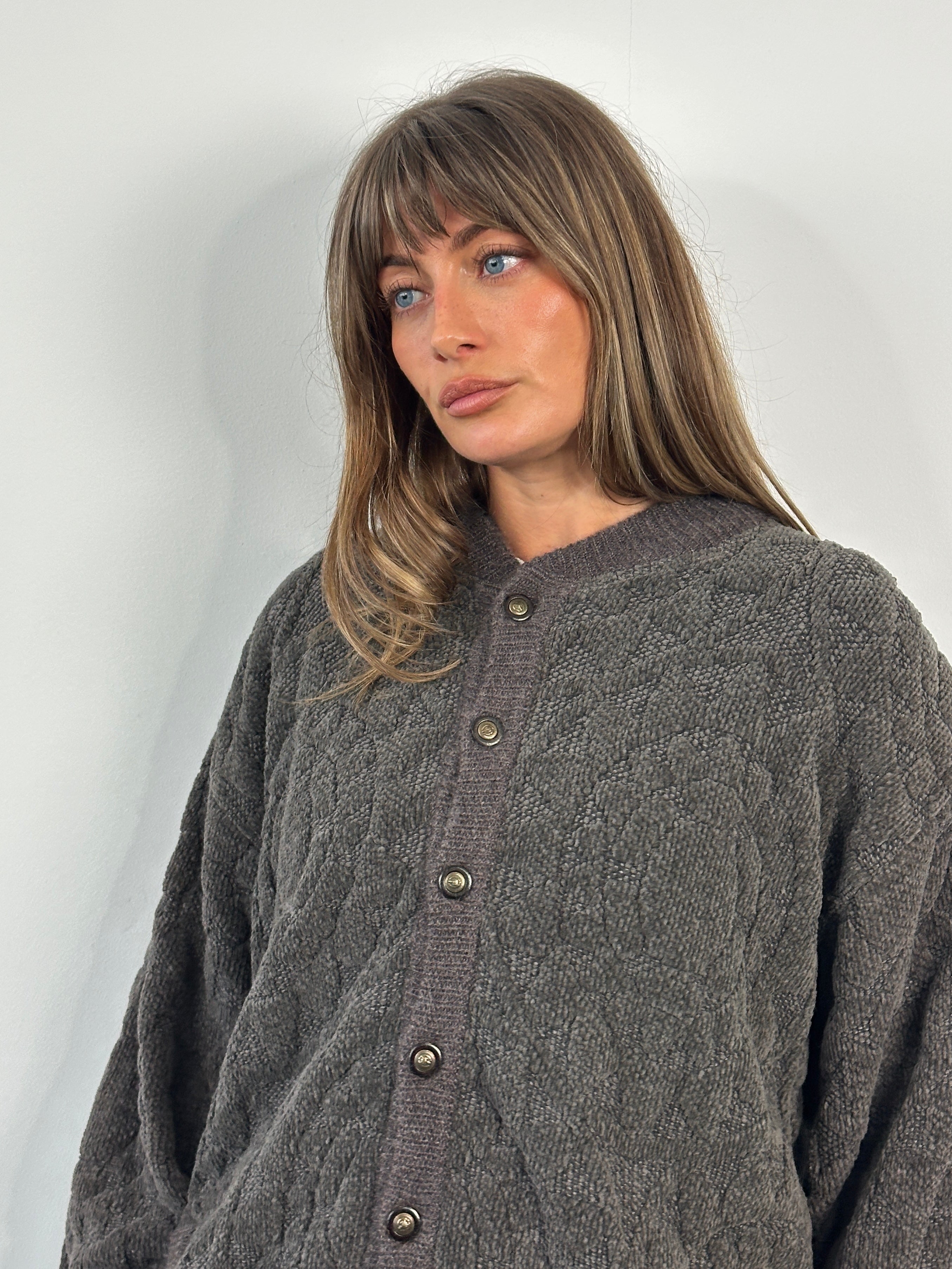 Vintage 1980s cotton knit bomber jacket in XL, featuring classic design and textured fabric, perfect for retro-inspired fashion.