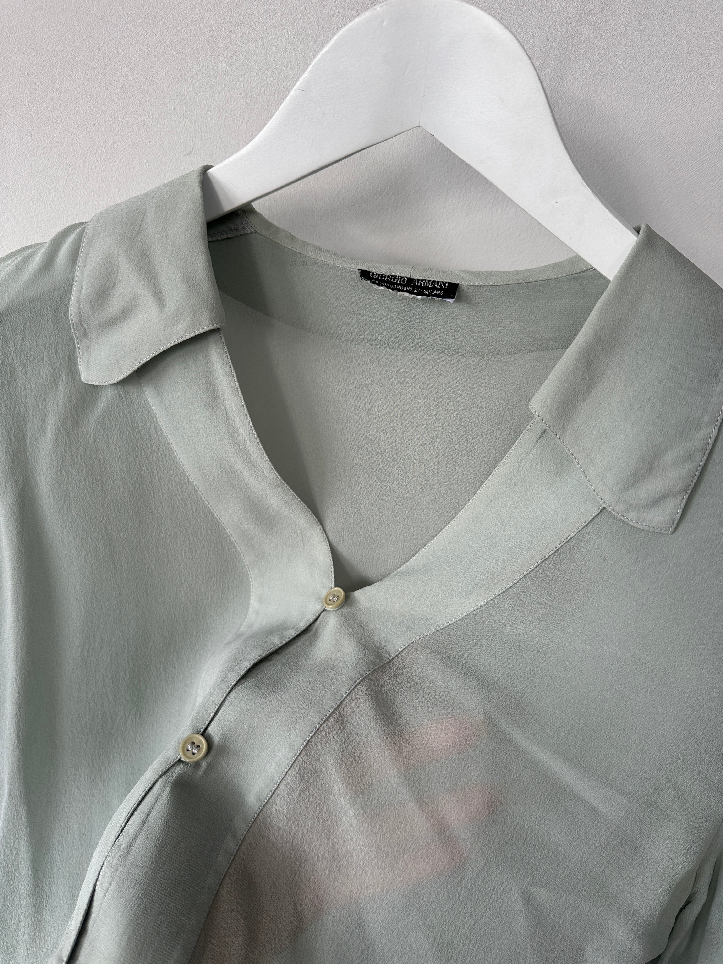 Giorgio Armani Black Label pure silk sheer blouse in black, lightweight shirt with elegant drape, size small, displayed on a hanger.