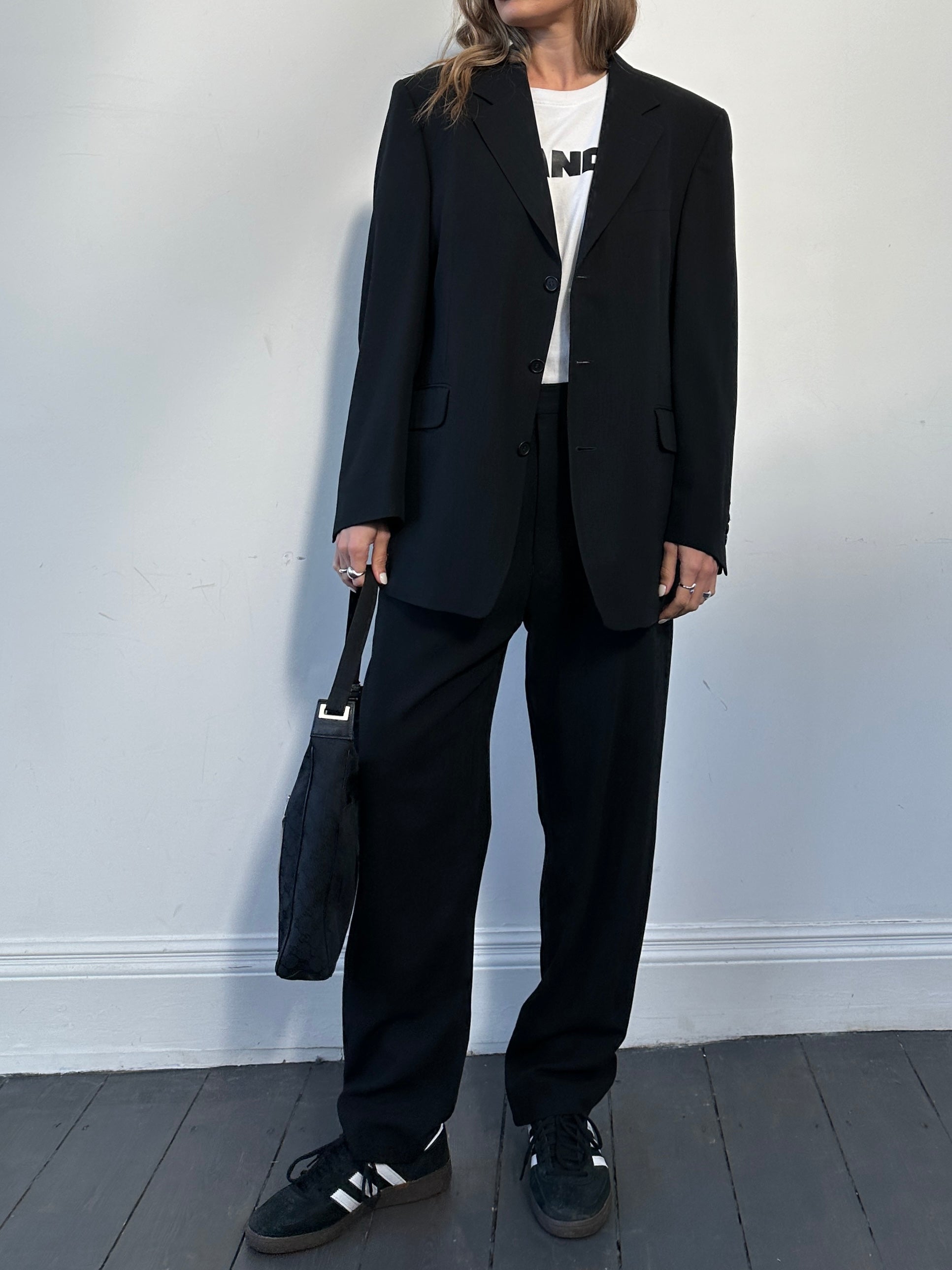 Yves Saint Laurent pure wool jumpsuit in size 42R/W32, tailored fit with classic design, shown on a mannequin.