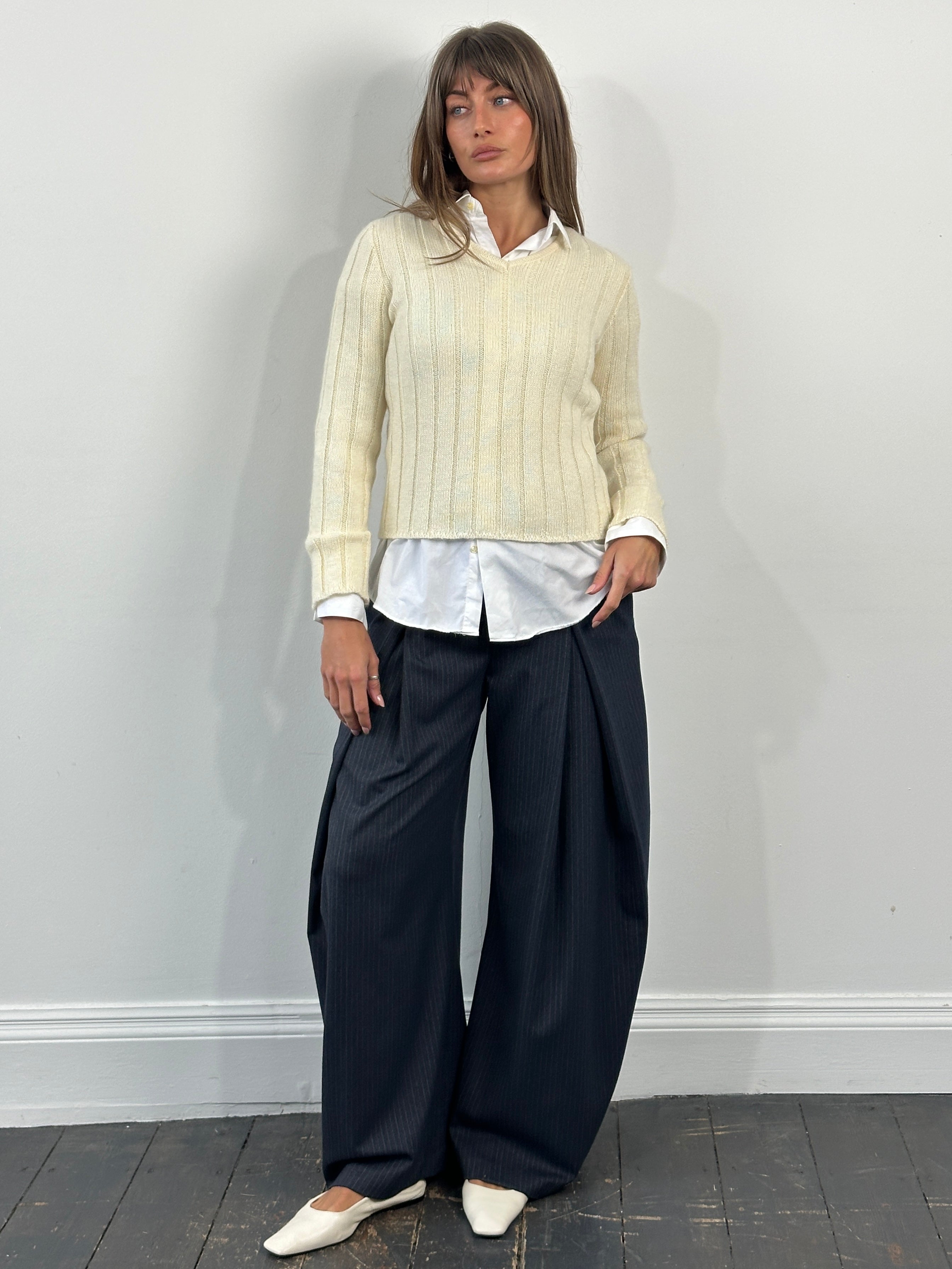 Valentino 1990s wool and mohair V-neck knitted jumper in size S, cream-colored, close-up of fabric and neckline detail.