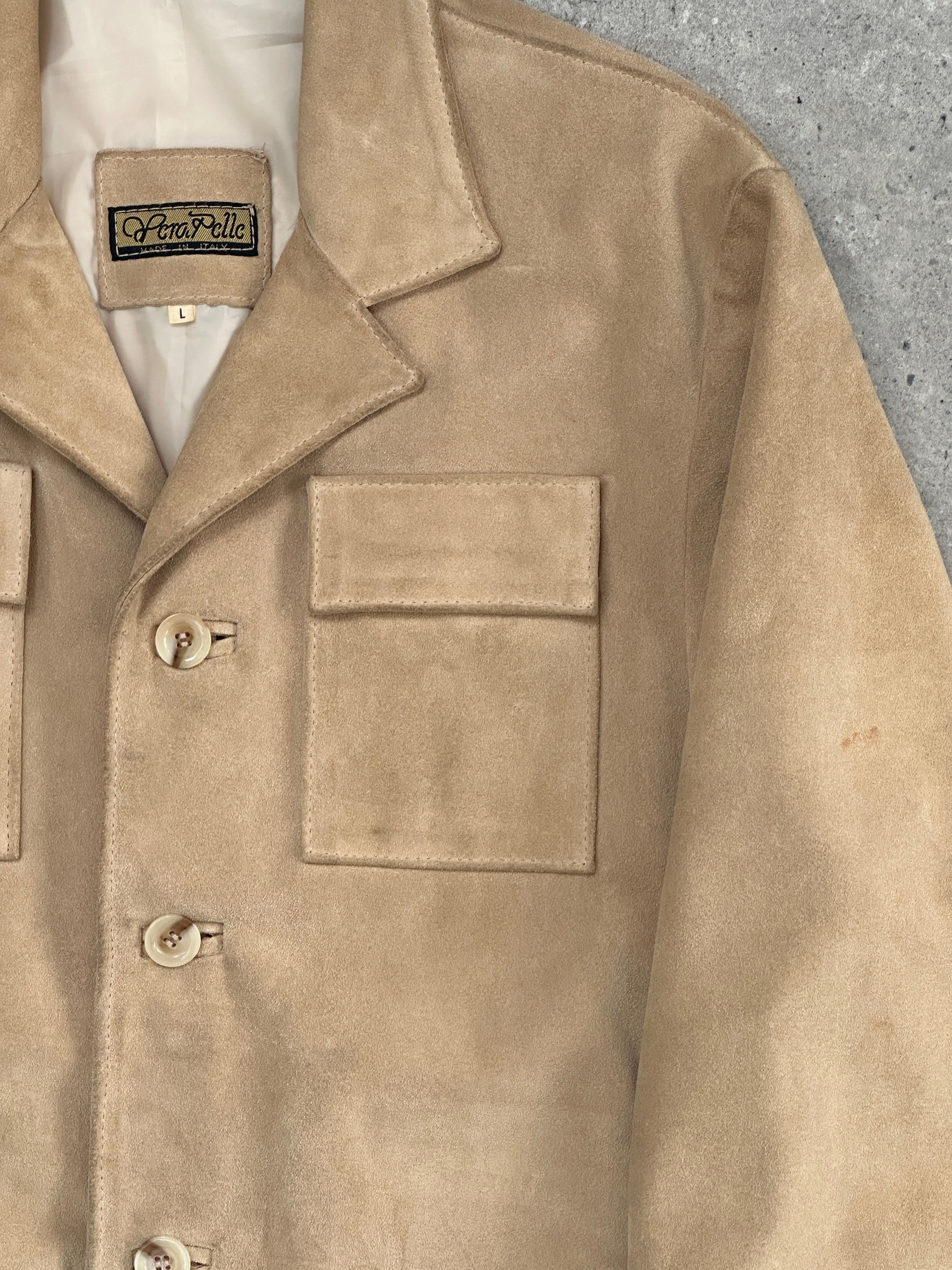 Vintage Italian vintage suede jacket in size L, featuring classic design and soft brown suede material.