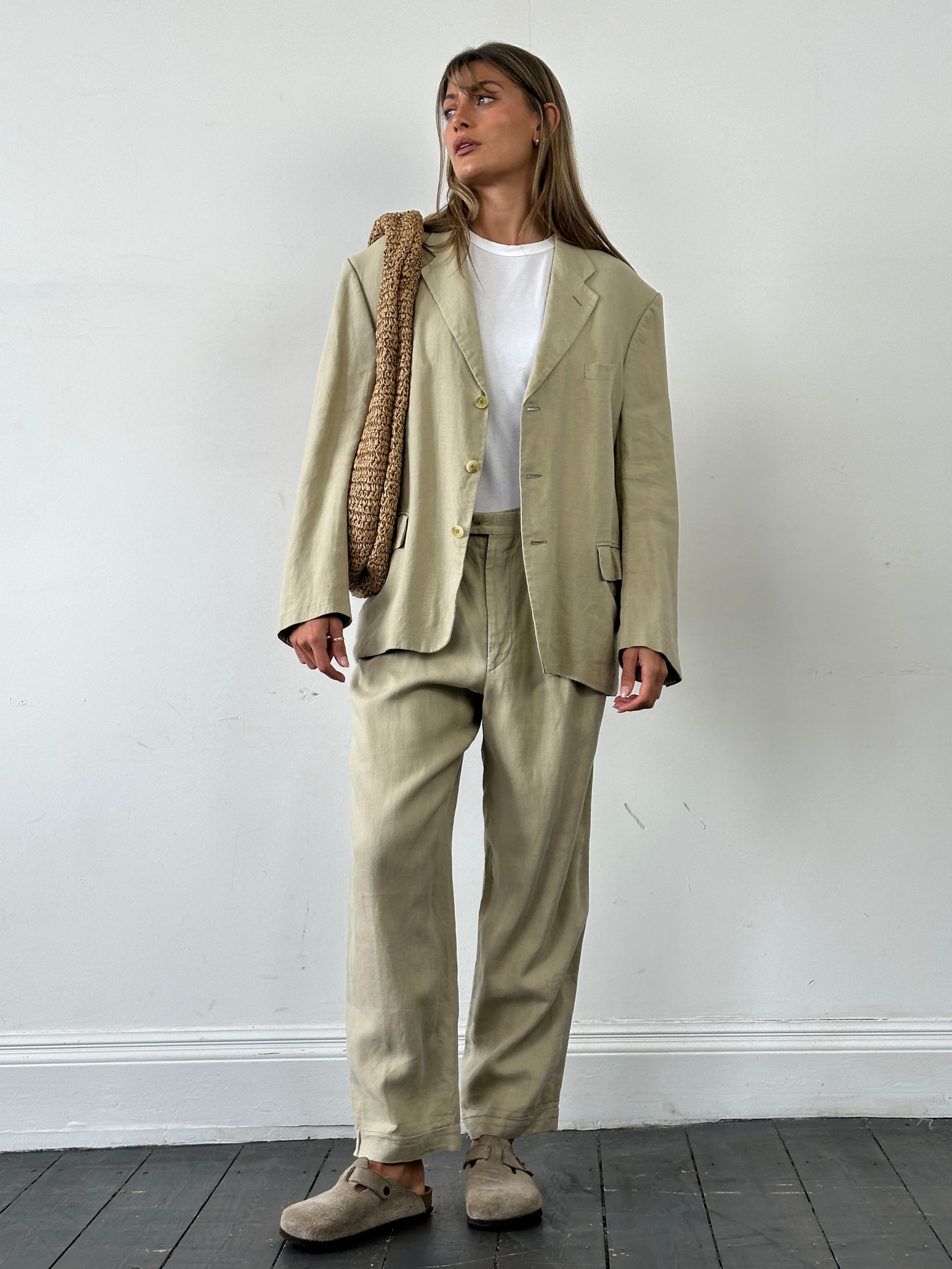 Christian Dior Monsieur pure linen single-breasted jumpsuit in size 42S/W32, displayed on a hanger with neutral background.
