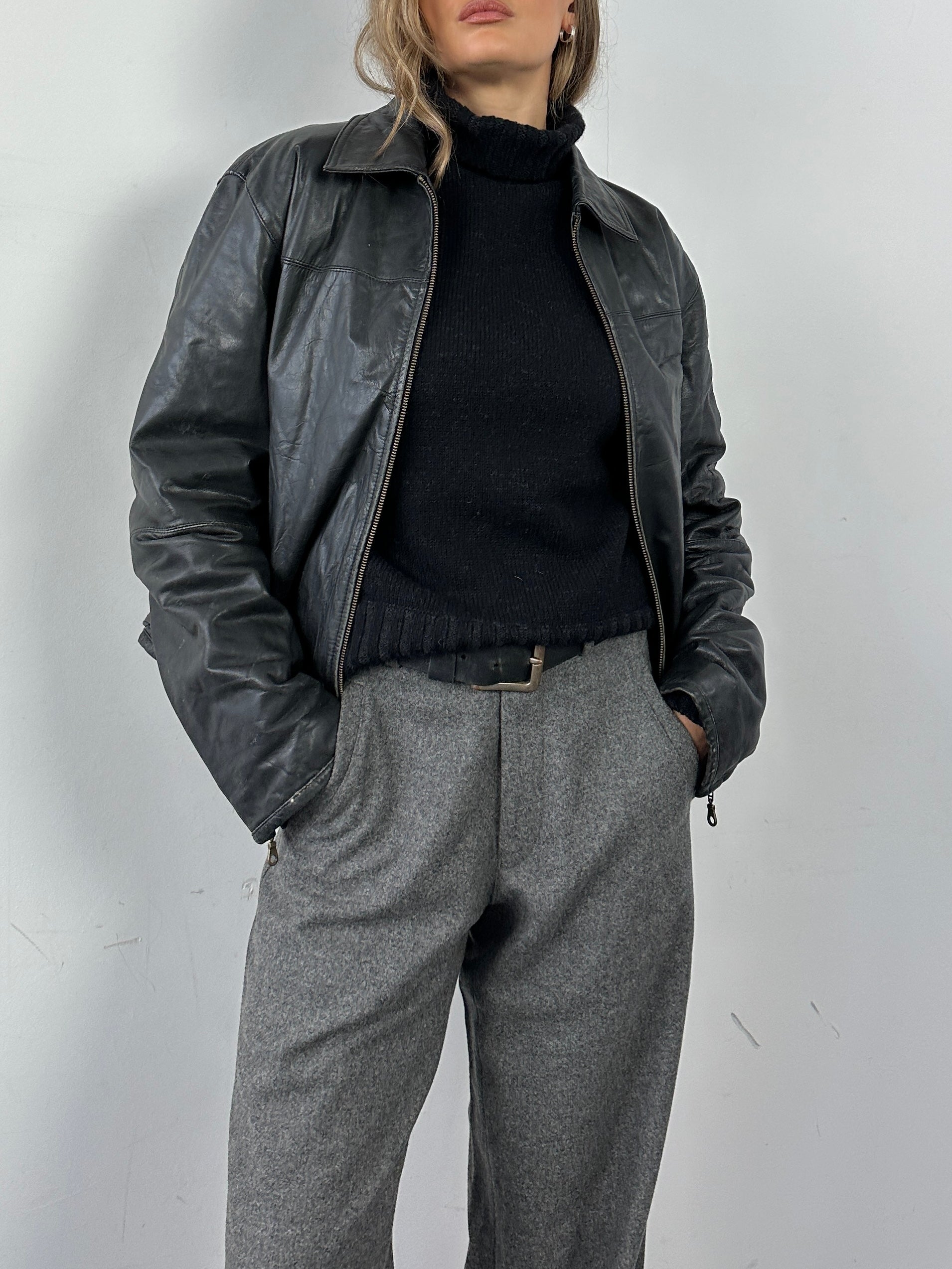 Conbipel leather jacket in size M/L, stylish men's or women's genuine leather outerwear with a sleek design.