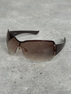 Gucci 2000s Tom Ford Era oversized shield monogram sunglasses with dark tinted lenses and bold black frames.