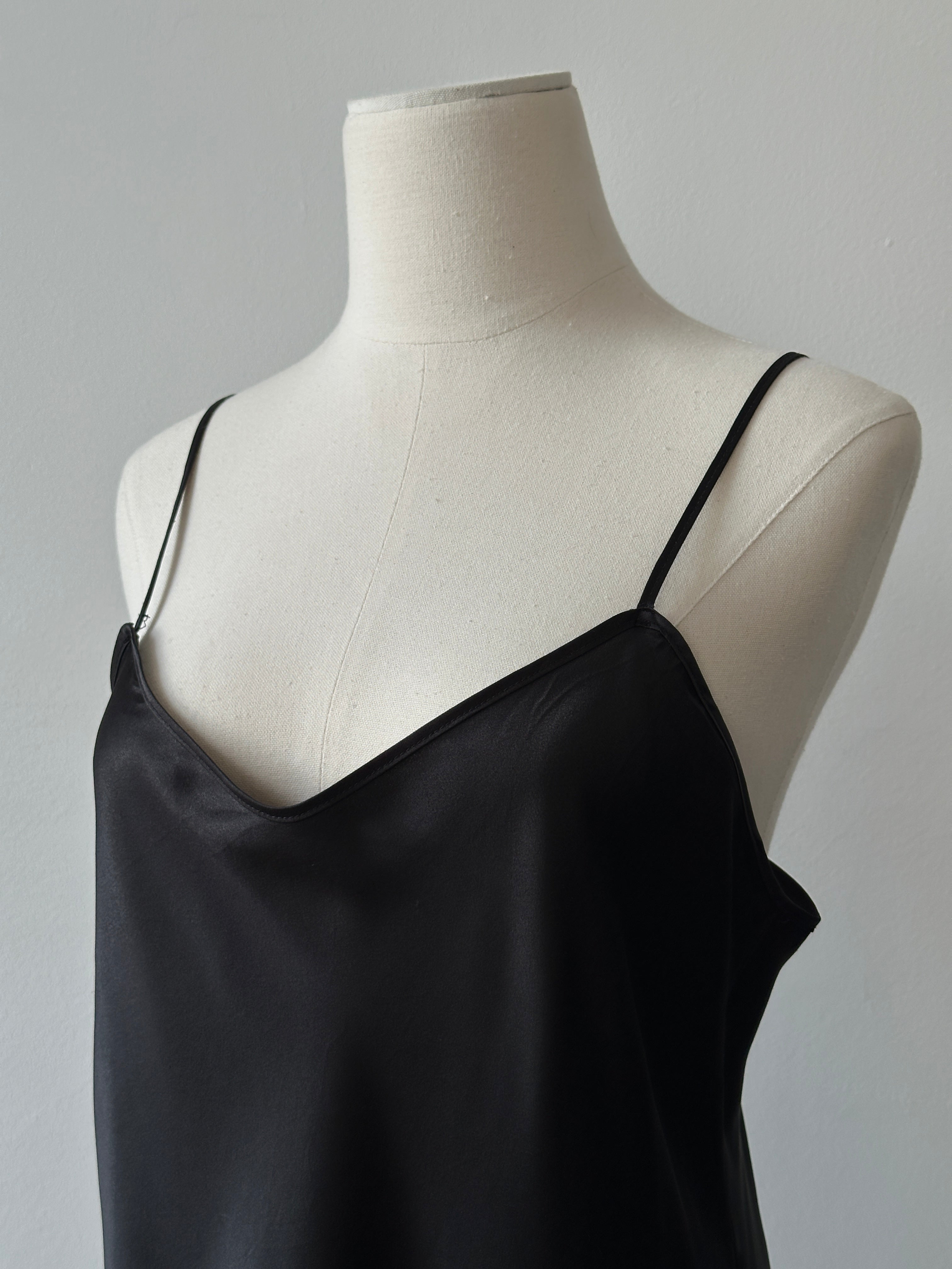 Vintage 1990s satin sleeveless dress in size M, featuring a sleek design and elegant fabric, displayed on a mannequin.