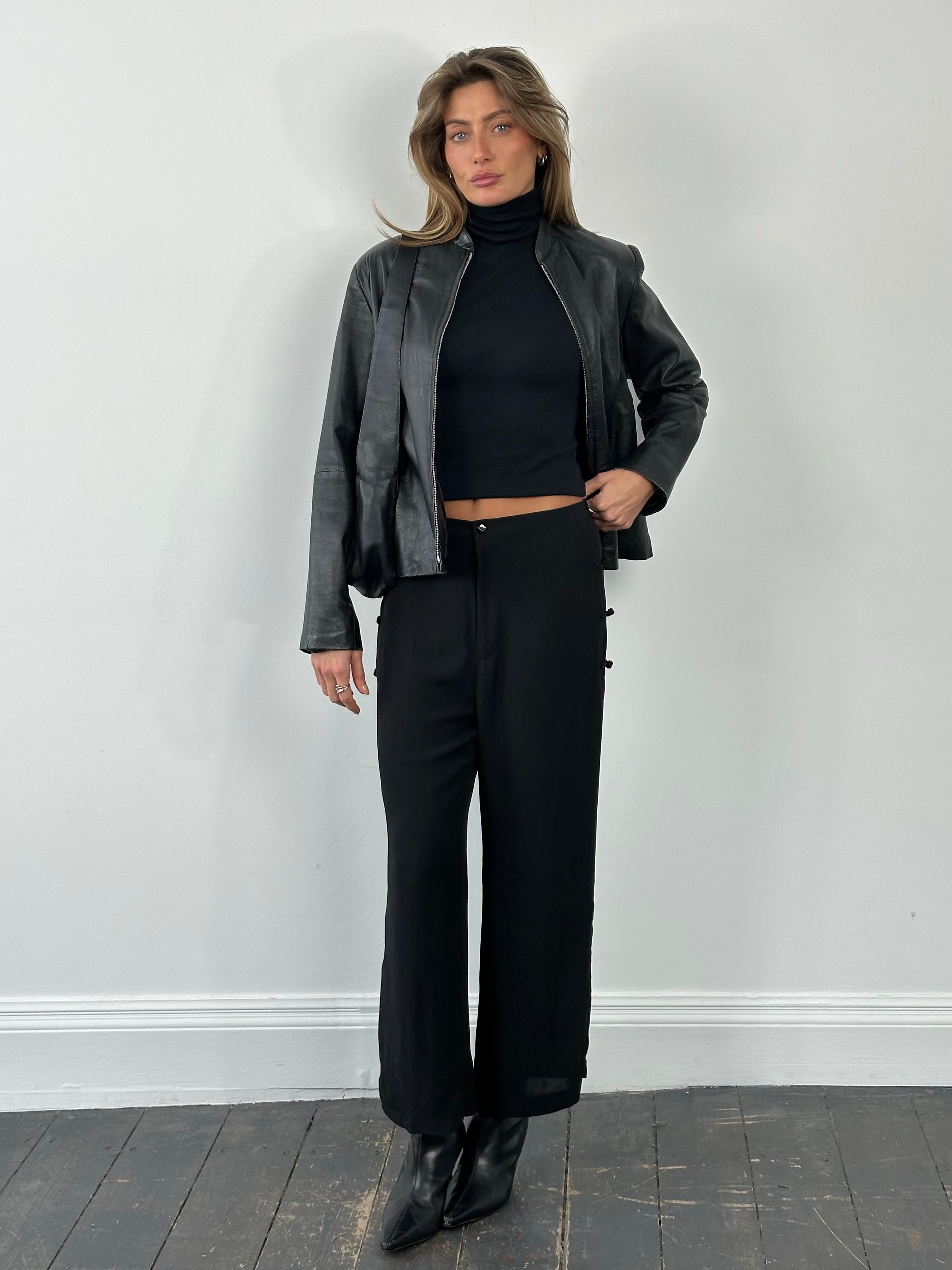 Vintage 1990s pure silk wide-leg trousers in size W28, featuring a luxurious fabric and classic wide-leg style.