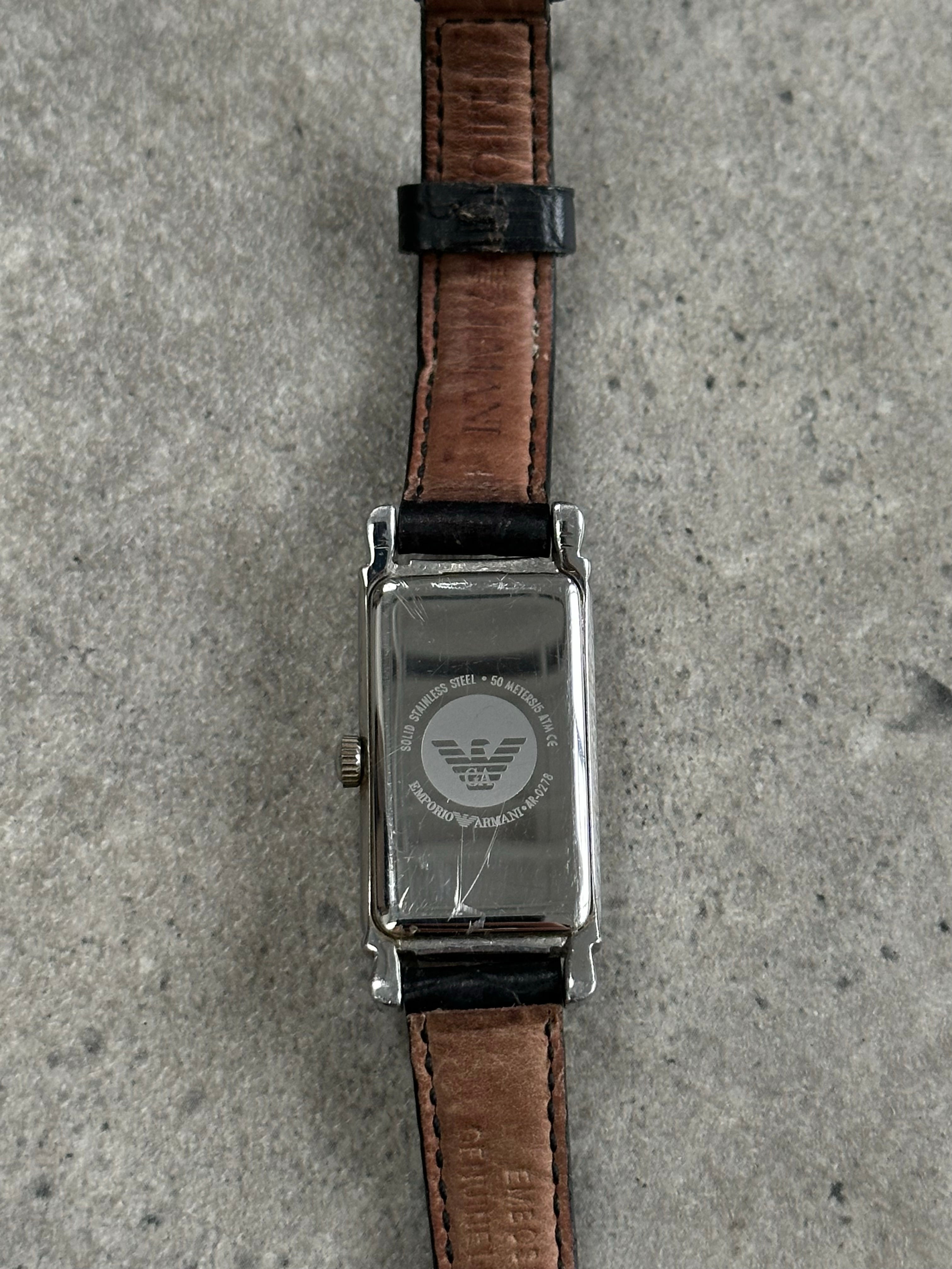 Emporio Armani 2000s leather watch with a sleek round dial and black leather strap, elegant and stylish men's wristwatch.