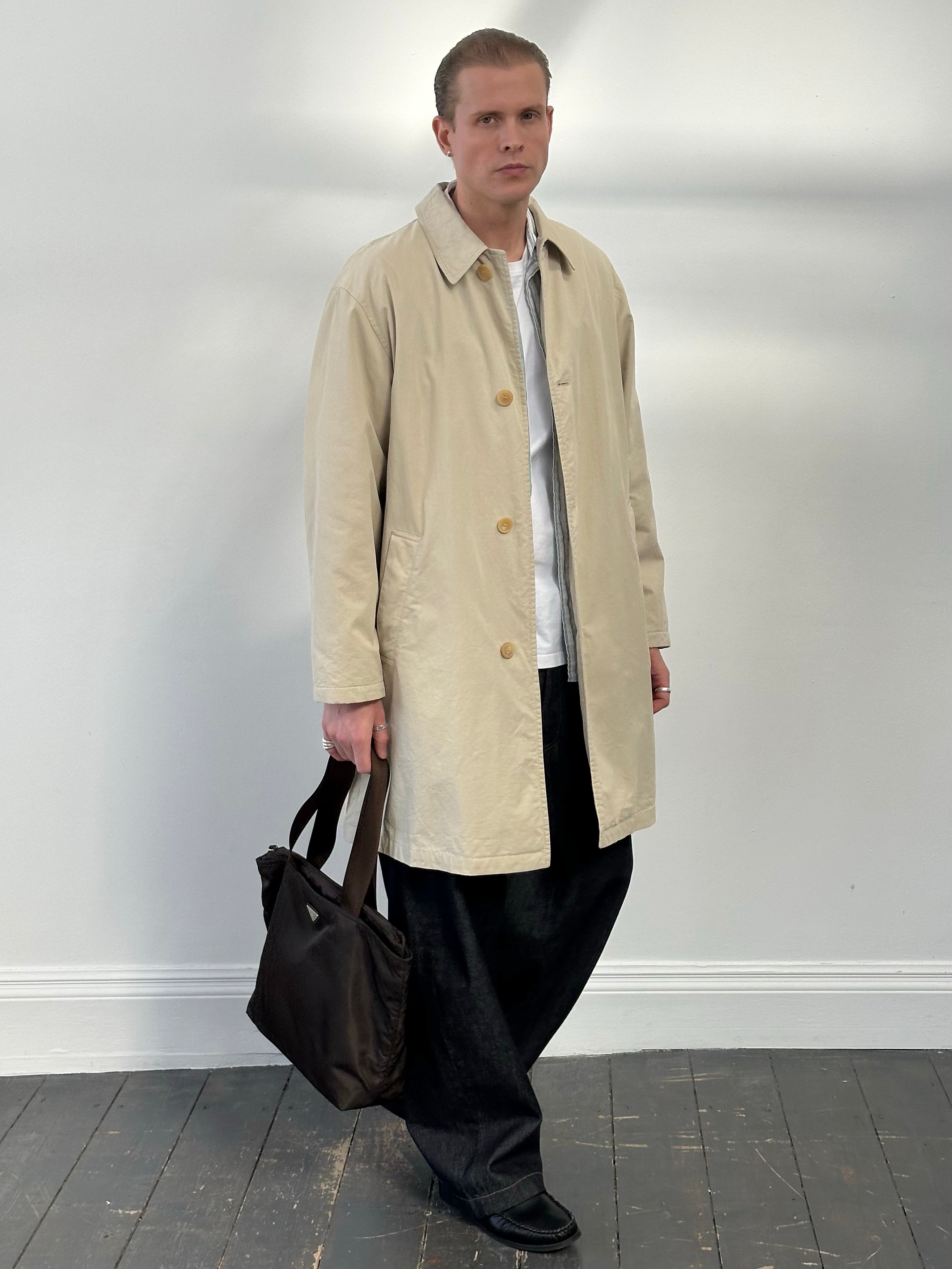 Hugo Boss 2000s cotton trench coat with concealed placket, long sleeves, and classic design in beige color.