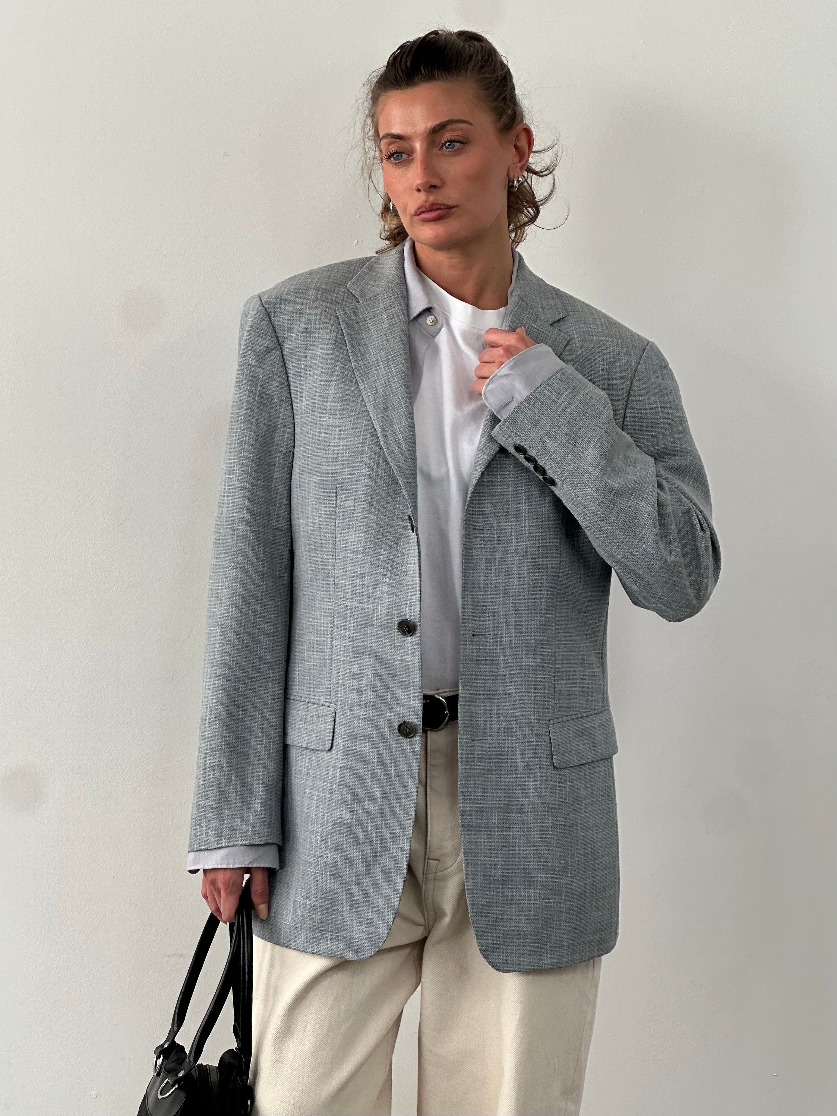 Loro Piana 1990s single-breasted blazer by Rene Lezard, in size L/XL, tailored fit, classic style, dark fabric with subtle texture.