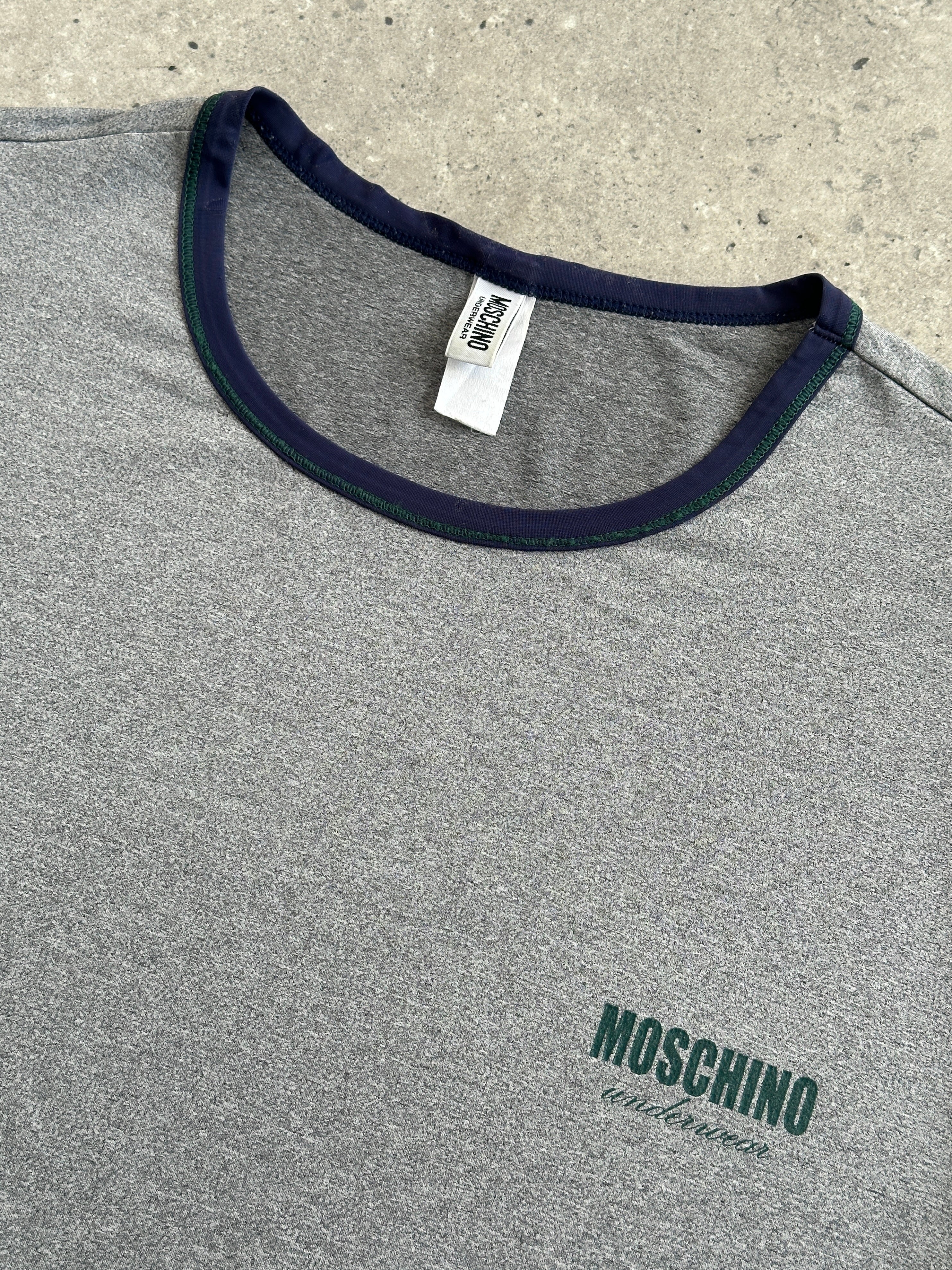 Moschino 1990s short sleeve tank top, men's underwear-inspired design, beige fabric, casual vintage style, front view.