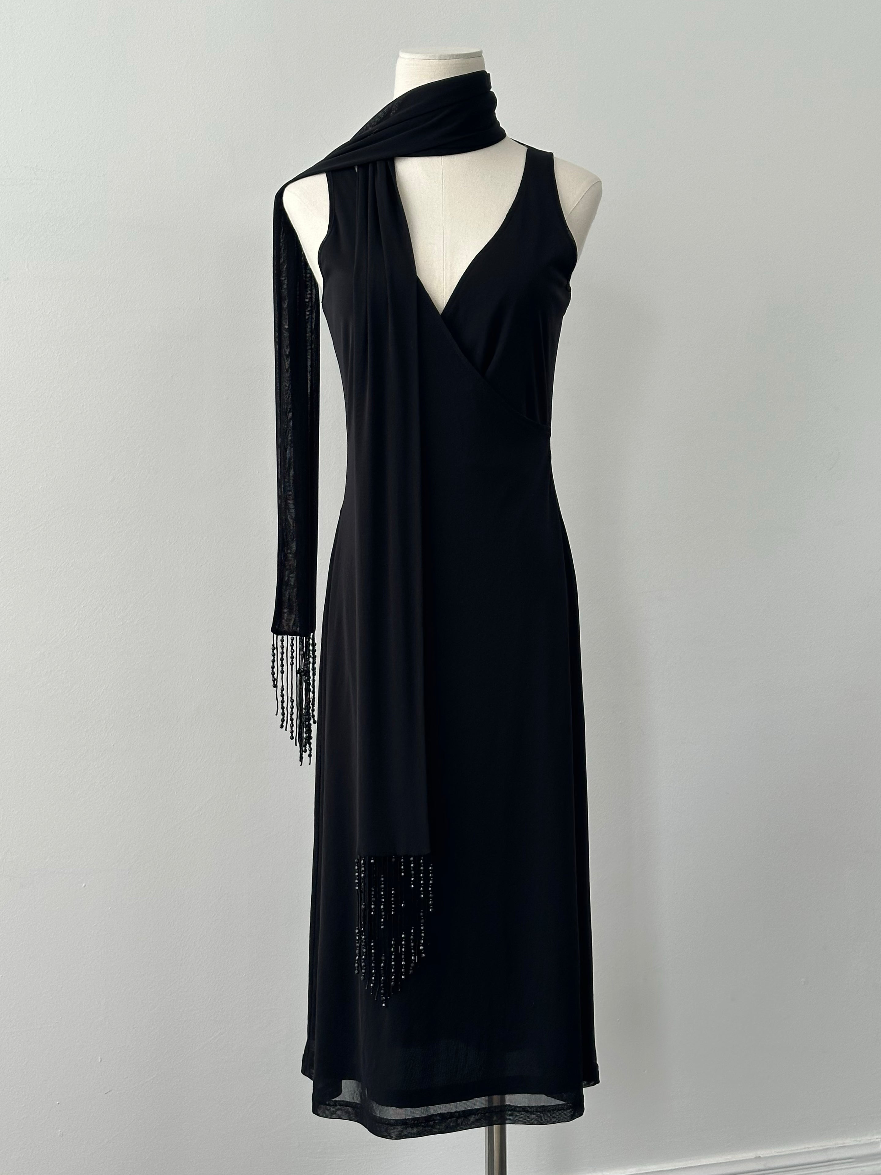 Vintage 1990s beaded scarf wrap midi dress, shown on a hanger with intricate bead detailing and flowing fabric.