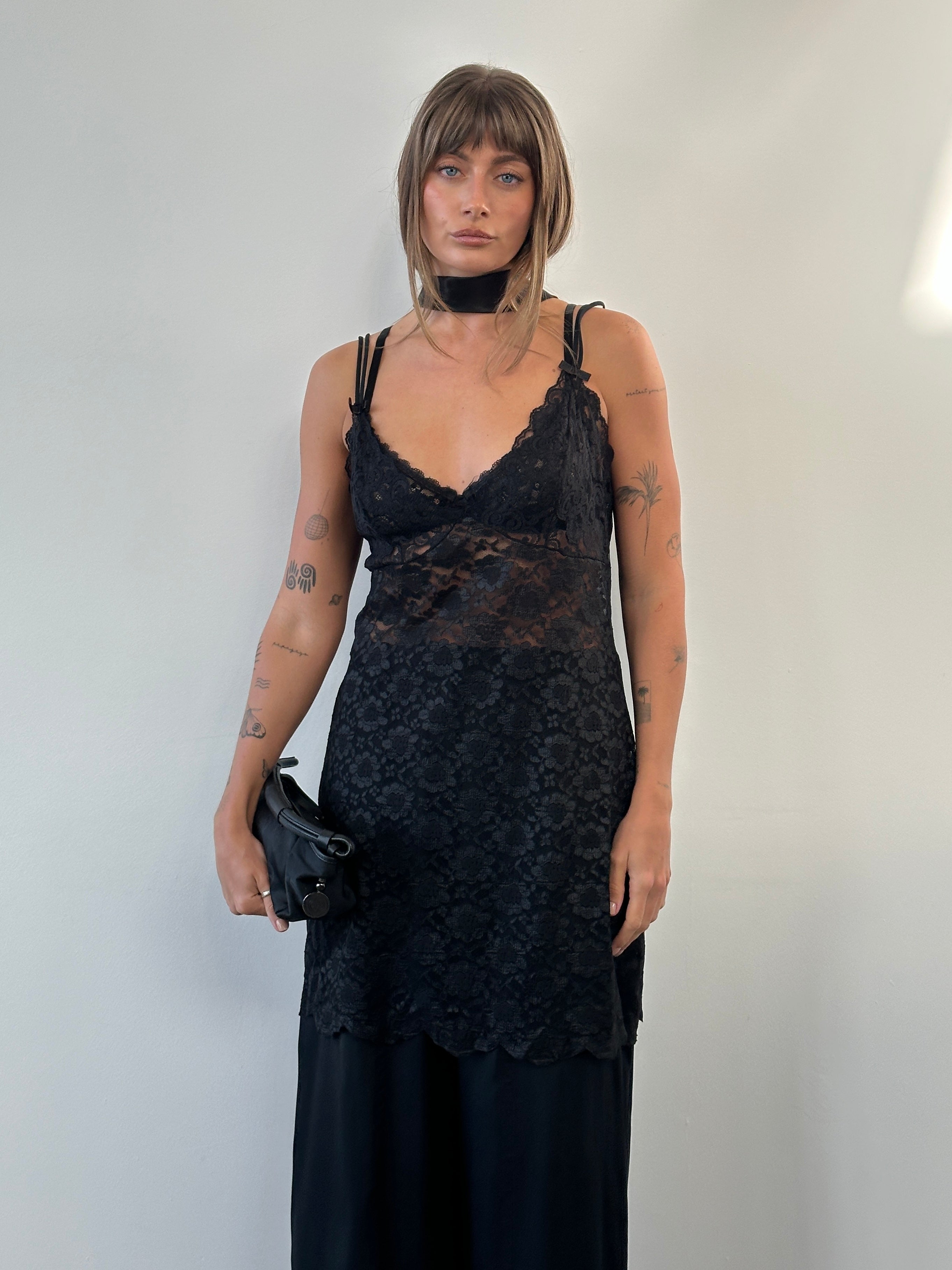 Vintage 1990s sheer lace mini slip dress, size large, featuring delicate lace fabric and a classic vintage style.