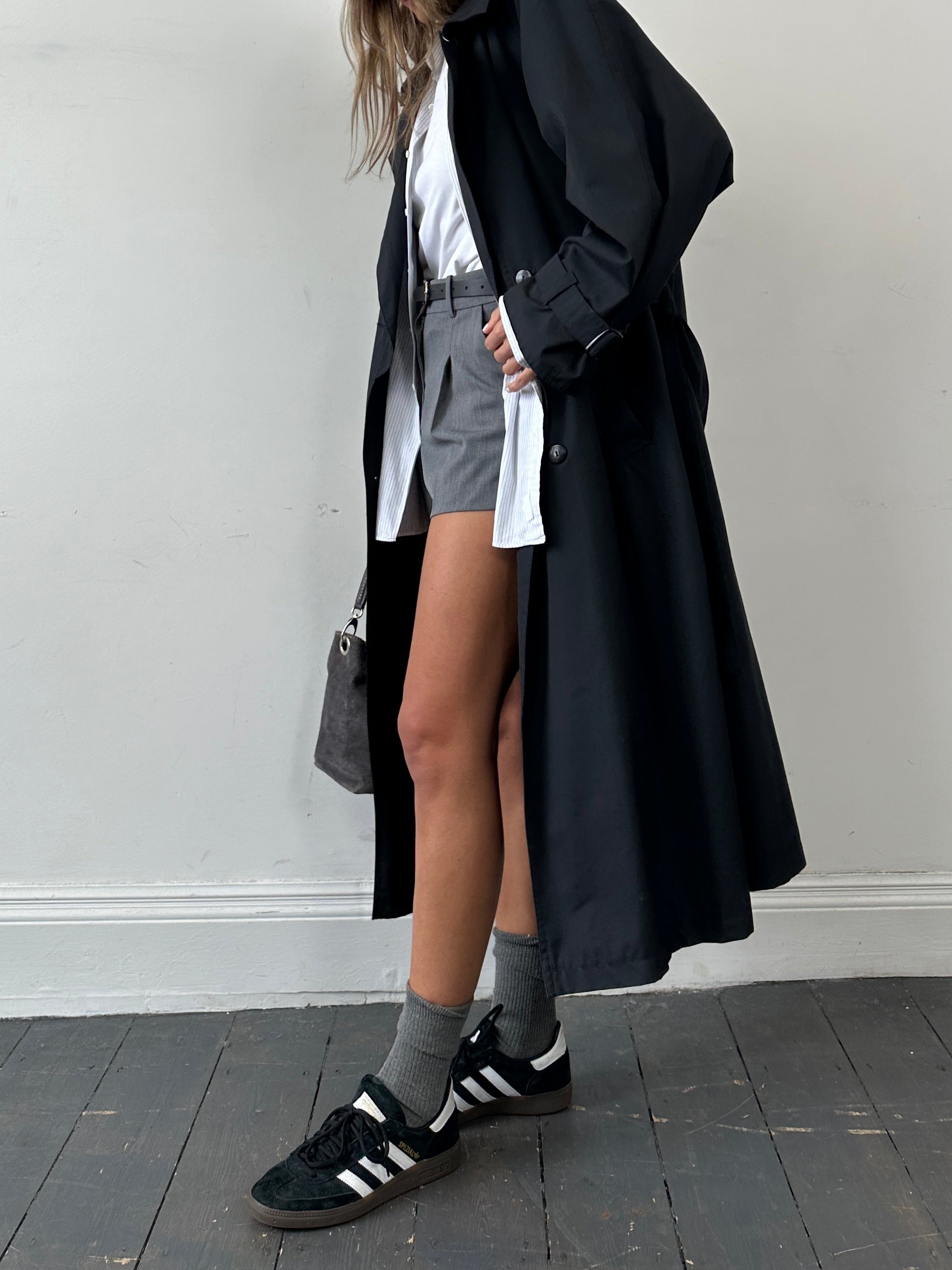 Vintage double-breasted floor-length belted trench coat in size XL, classic style with structured collar and button details.