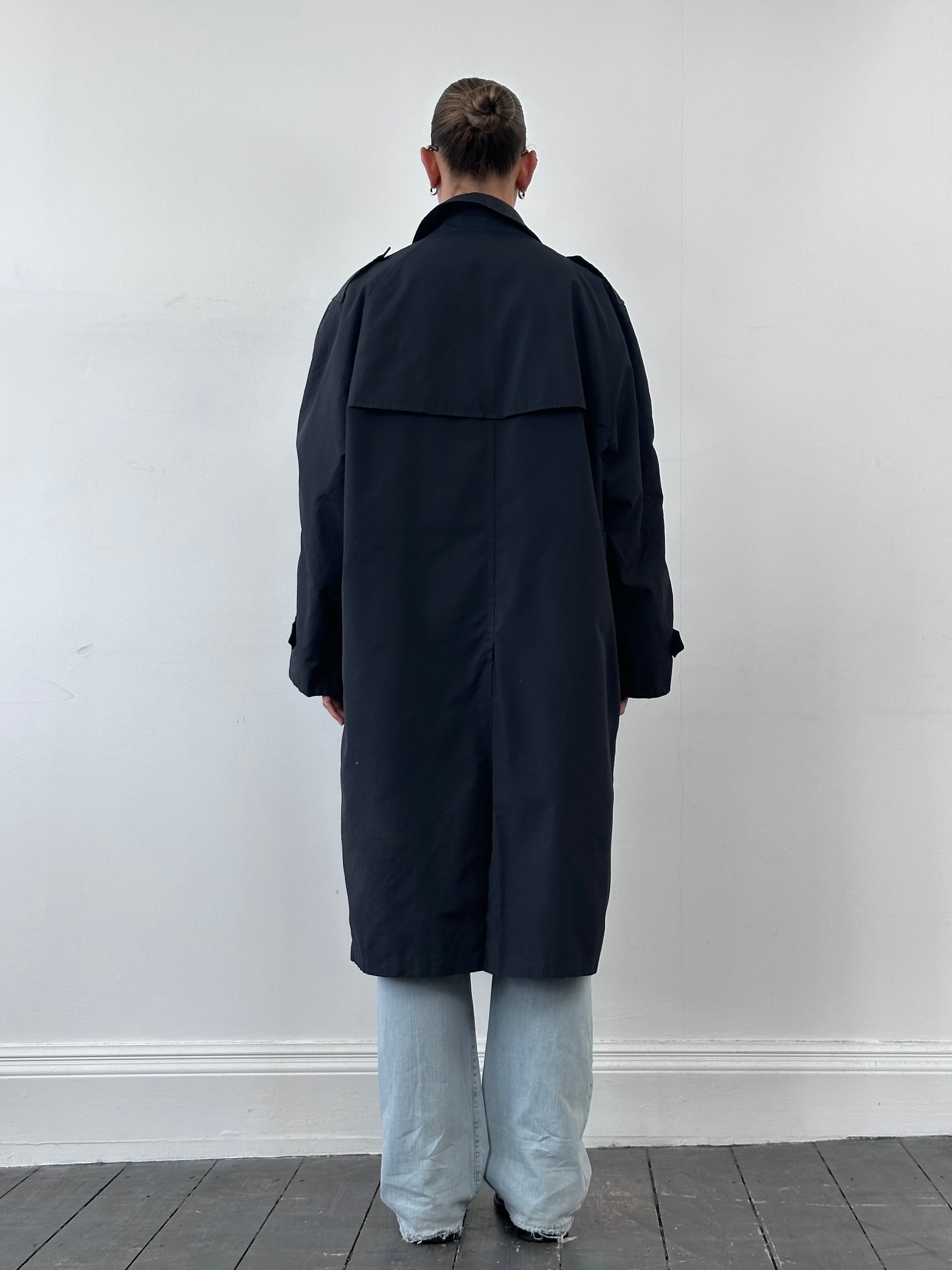 Christian Dior Monsieur double-breasted trench coat in XL, shown hanging with classic collar and button details.