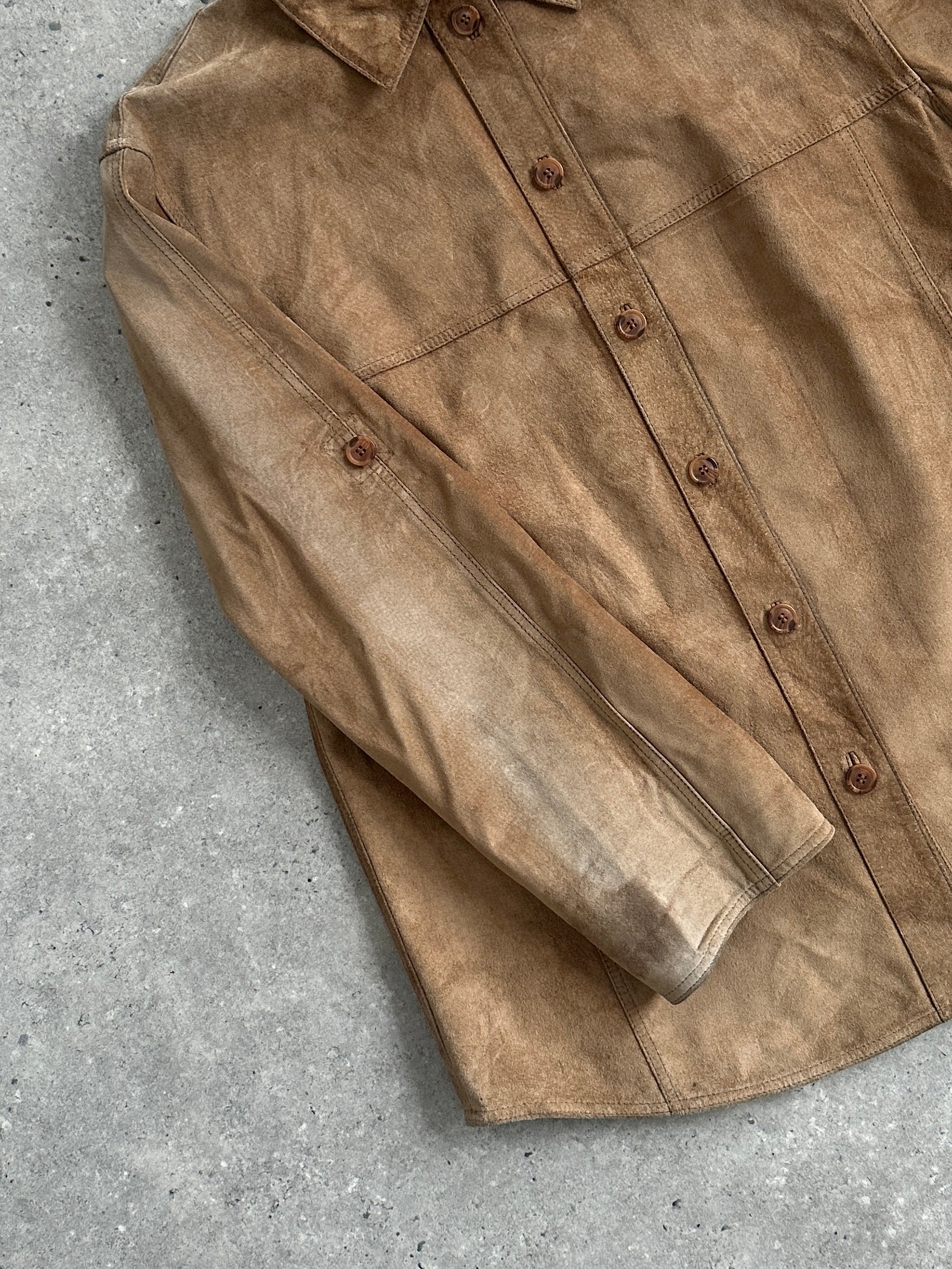Vintage suede shirt in size large, featuring a classic button-up design with a soft, textured suede fabric, ideal for casual wear.