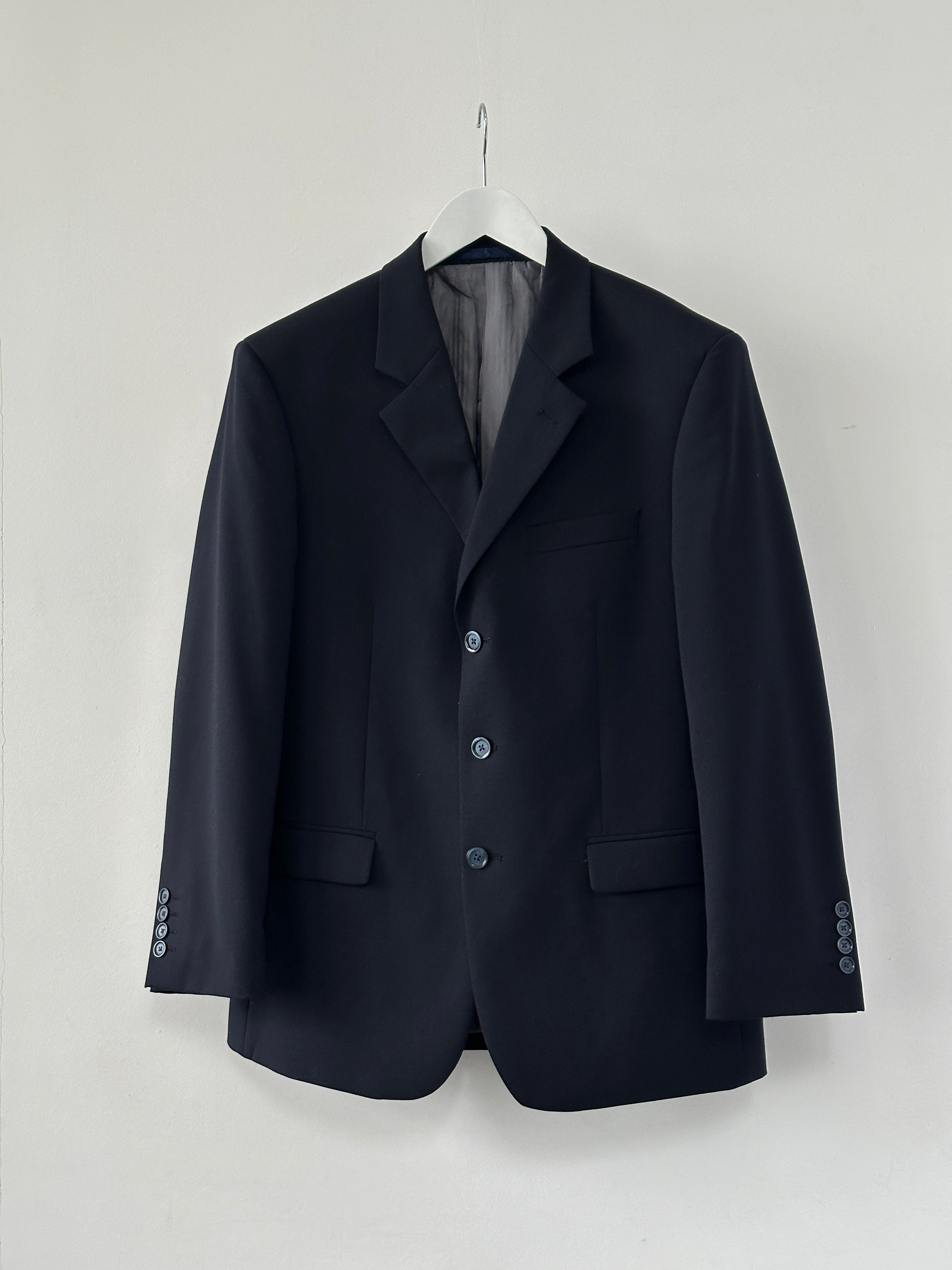 Vintage wool single-breasted blazer in size 38S/L, tailored fit, classic style, shown on a hanger against a neutral background.