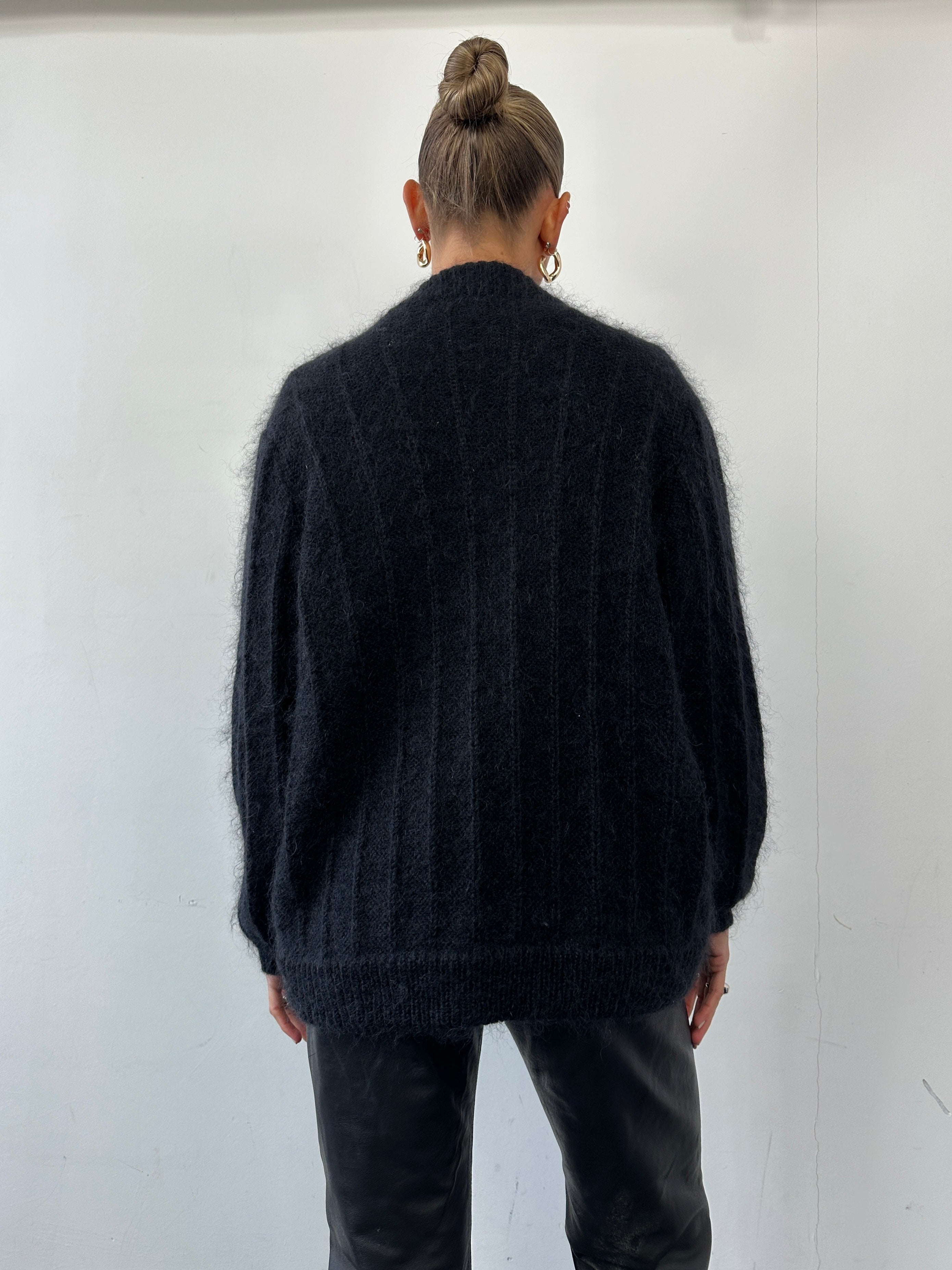 Vintage mohair knitted cardigan in size M, soft cream color, featuring a cozy, textured knit pattern.
