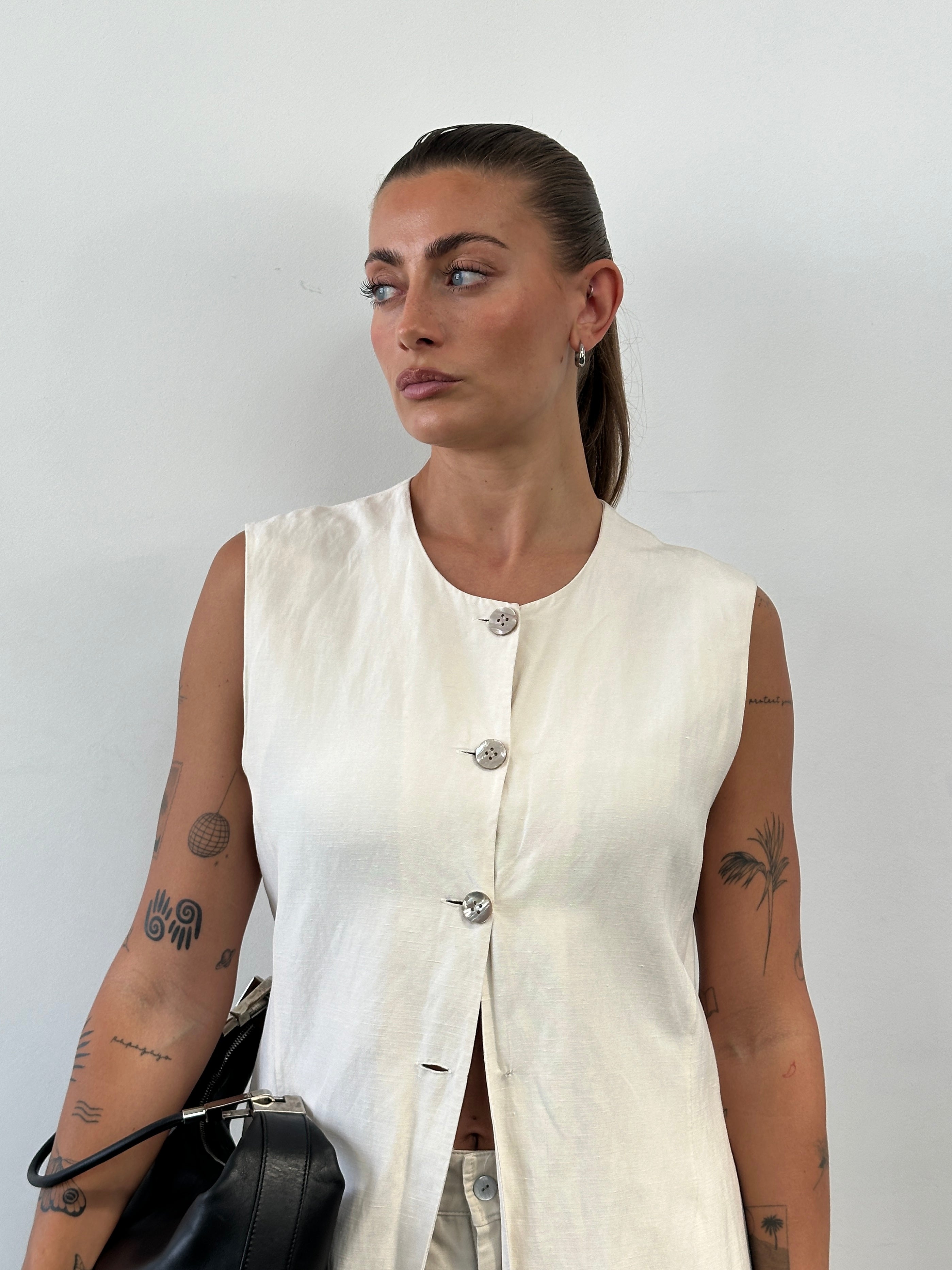 Laura Ashley silk linen waistcoat in size L, featuring a tailored fit and elegant design, displayed on a neutral background.
