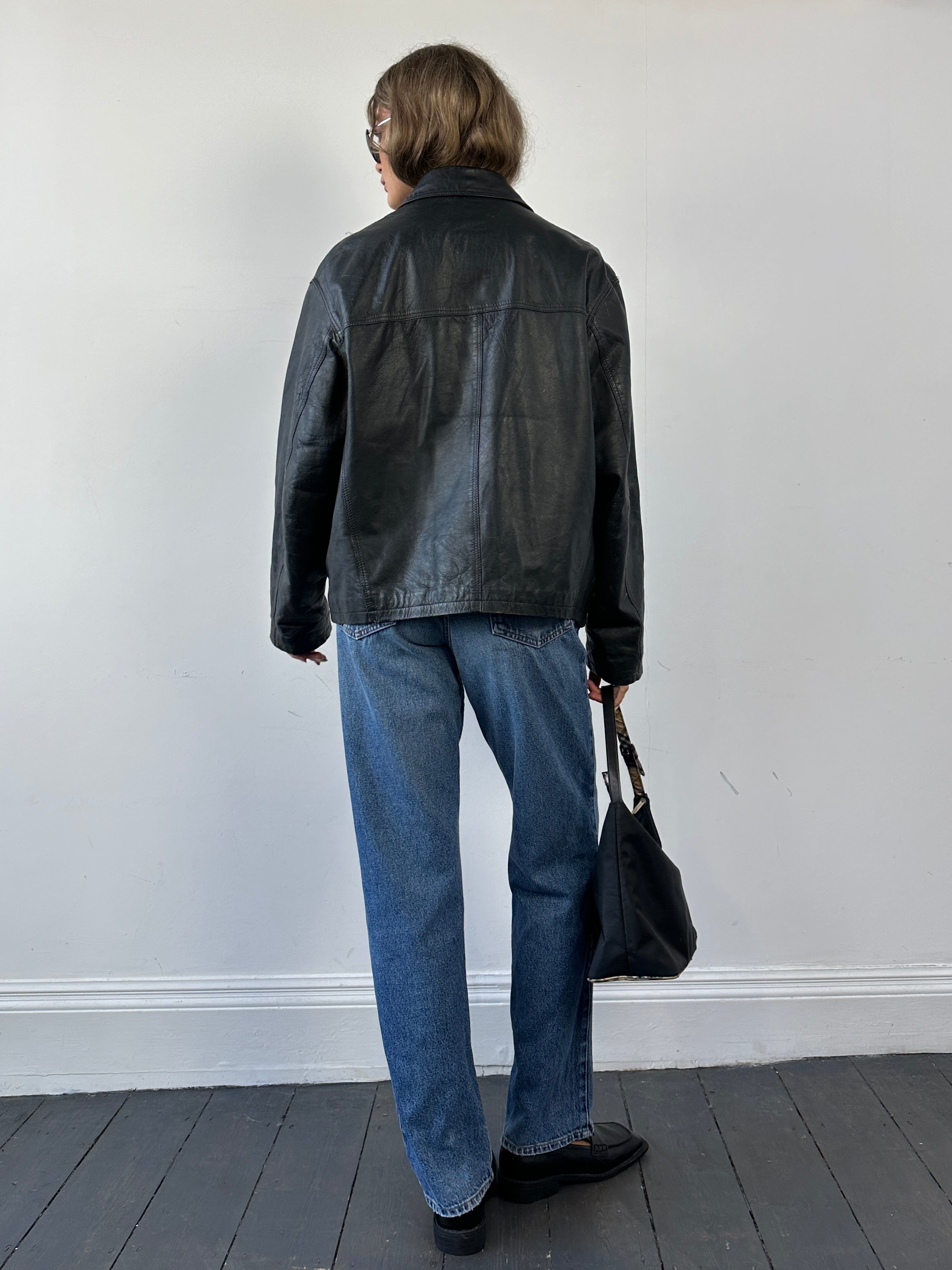Conbipel distressed leather jacket in size L, featuring rugged design and stylish detailing, displayed on a neutral background.