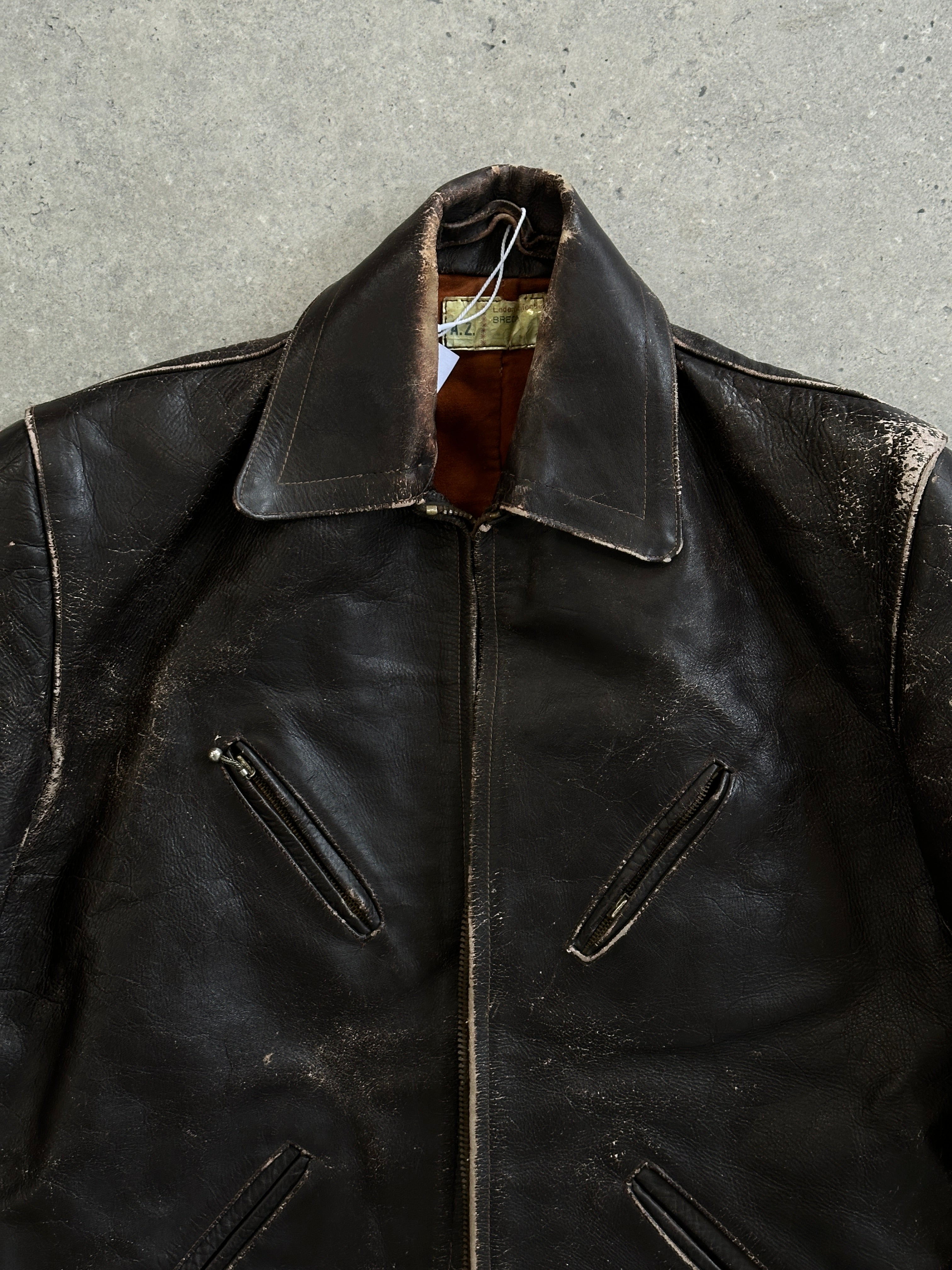Vintage distressed structured leather jacket in size S/M, featuring rugged design and classic style.