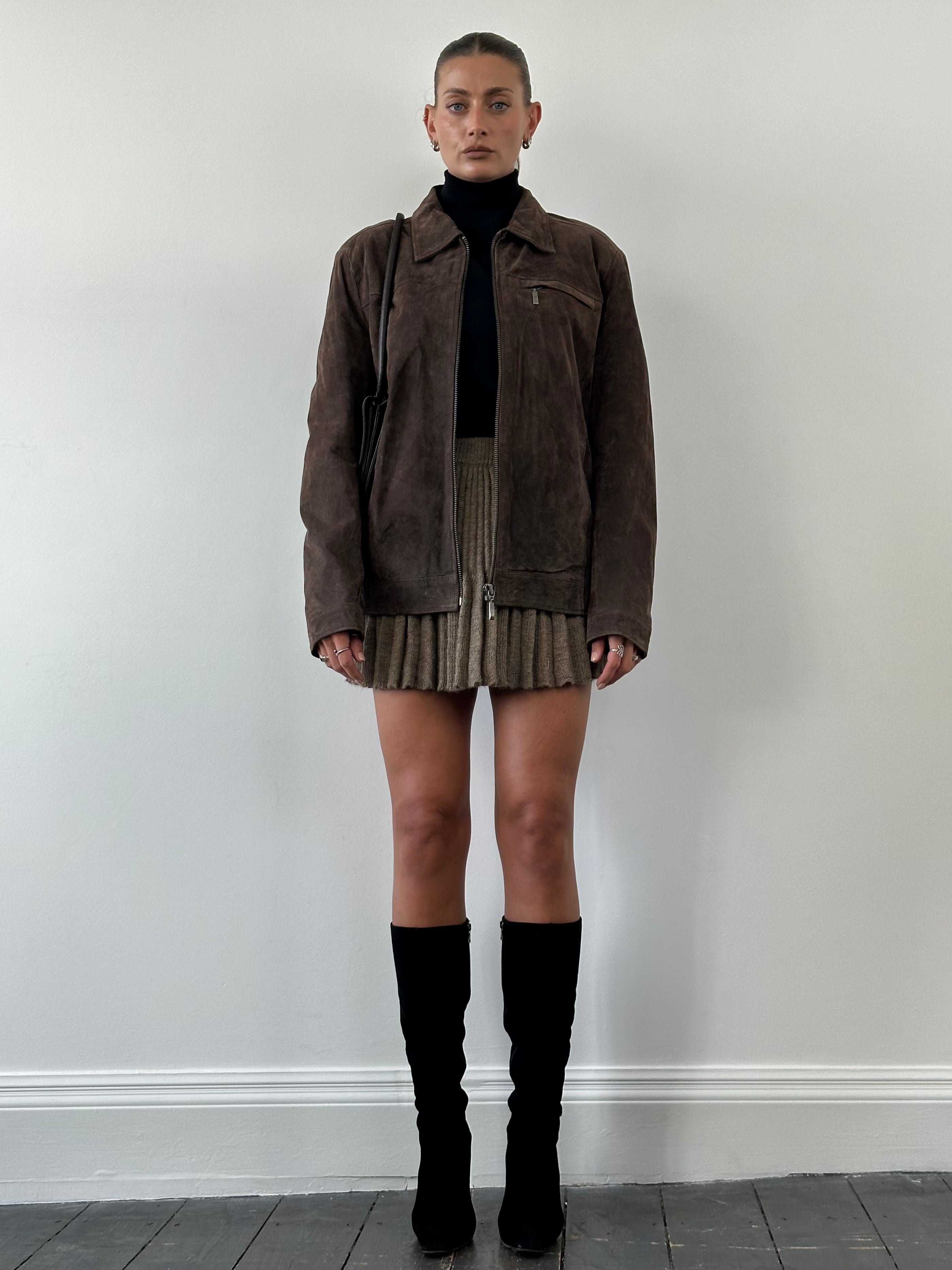 Vintage suede zip-up jacket in size large, featuring a classic design with a front zipper and soft suede material.