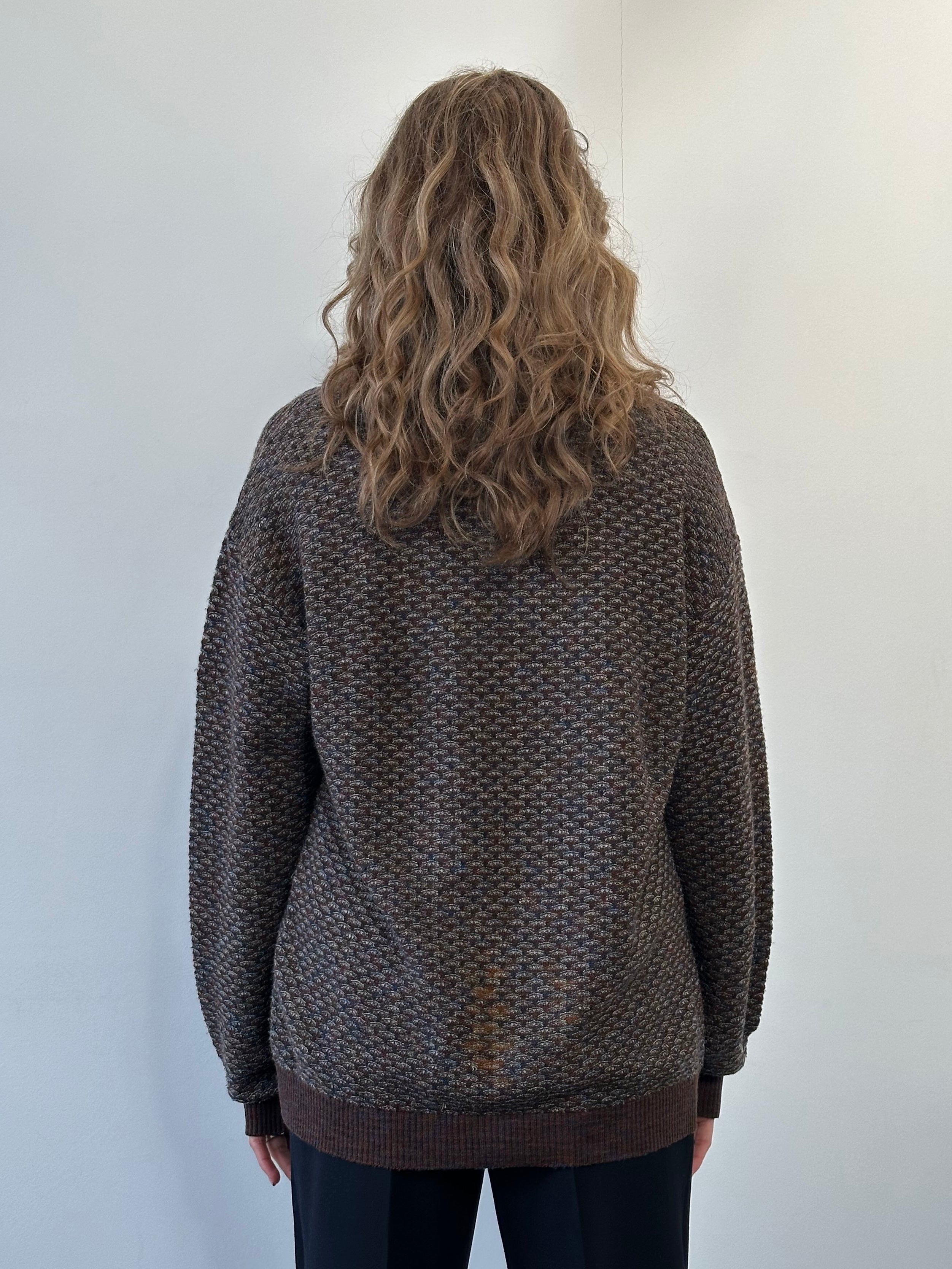 Missoni V neck wool knitted jumper in size large, featuring colorful zigzag pattern and cozy knit texture.