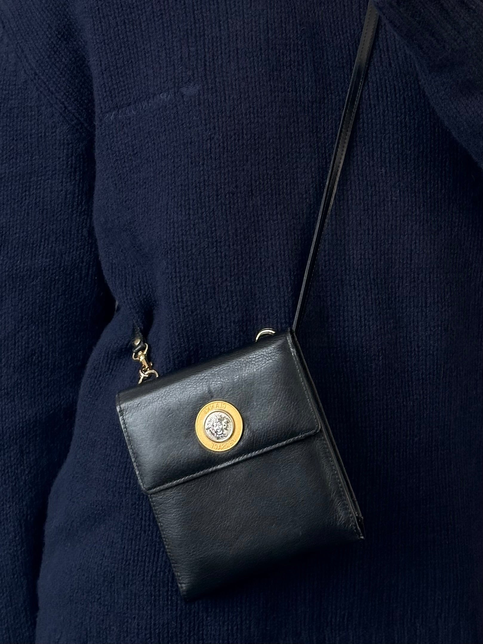 Gianni Versace 1990s Medusa leather crossbody bag featuring iconic Medusa head design and sleek black leather finish.