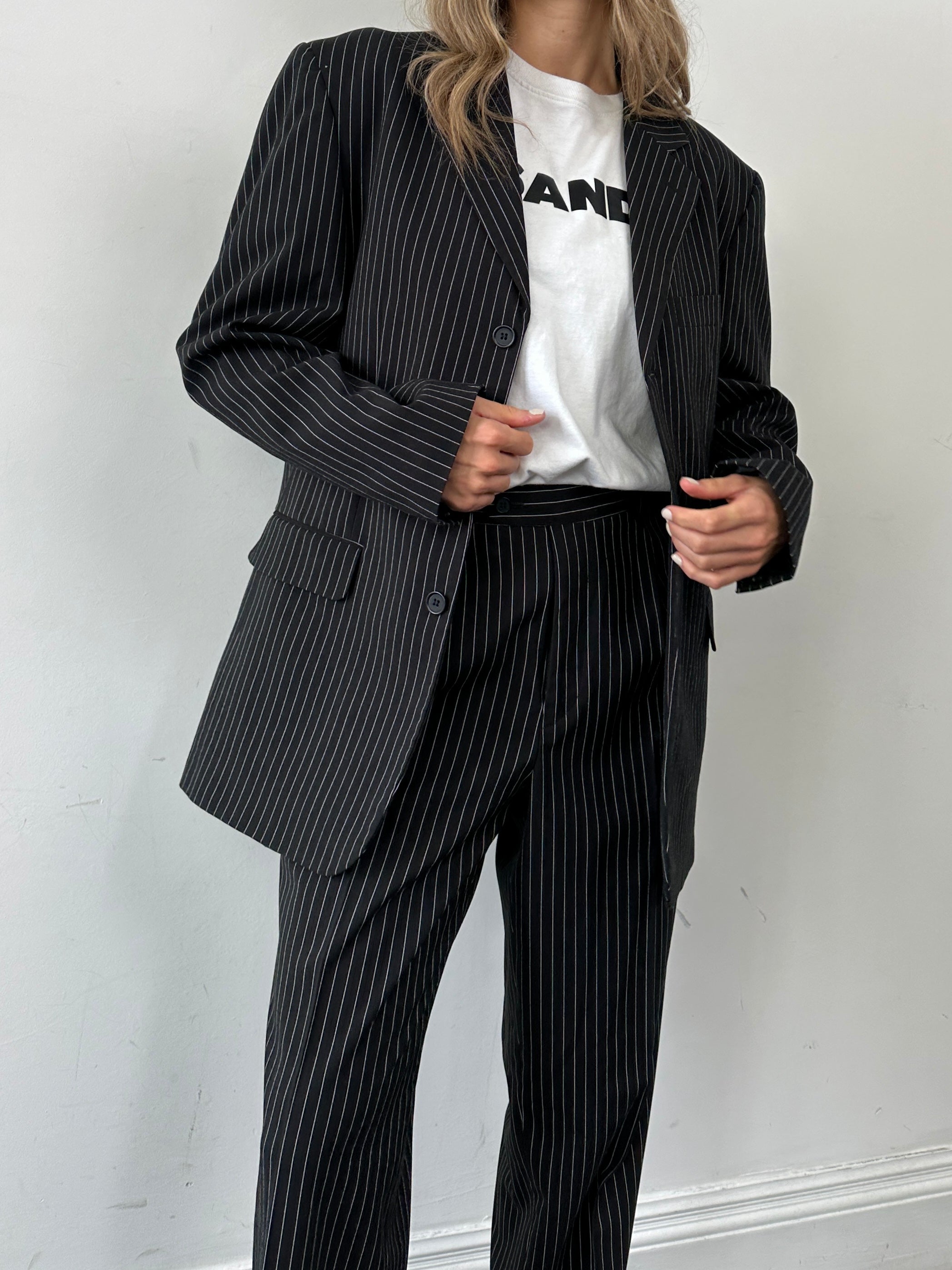 Vintage pinstripe single-breasted suit jumpsuit in size 40R/W36, tailored fit with classic pinstripe pattern and lapel collar.