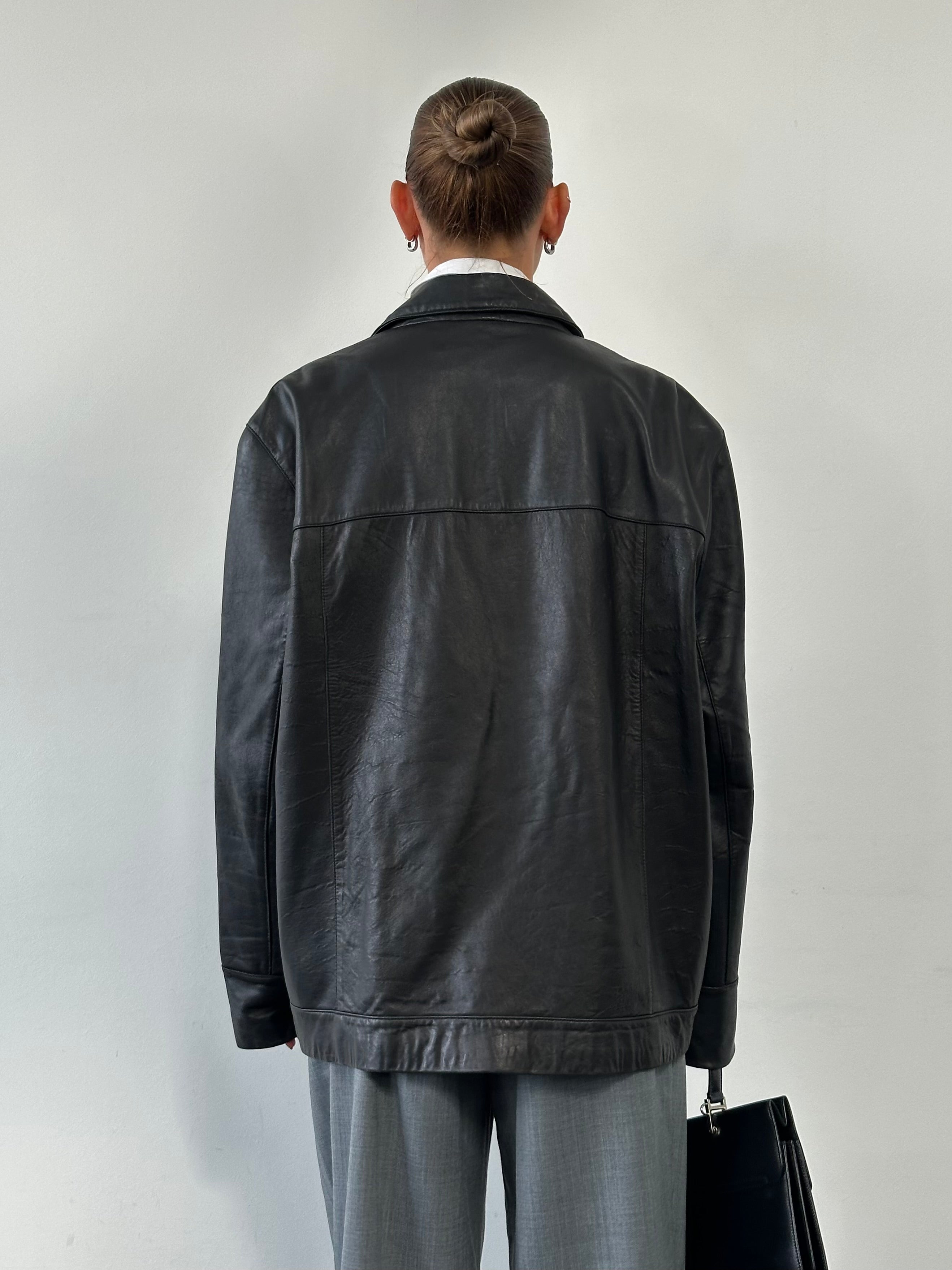 Balmain smooth leather jacket in XL size, showcasing sleek black leather with classic collar and zipper details.
