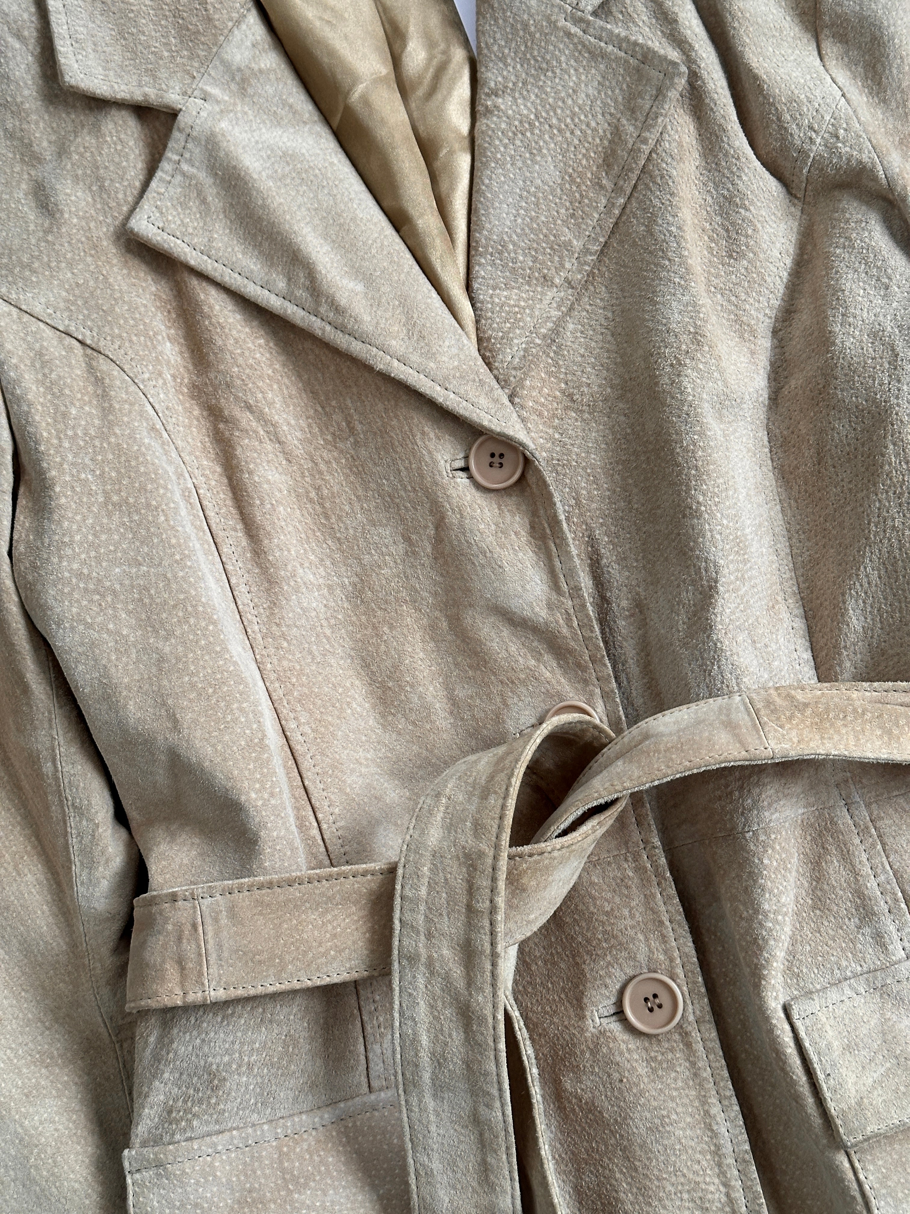 Vintage belted suede jacket in size M, featuring classic design and stylish details, displayed on a hanger.