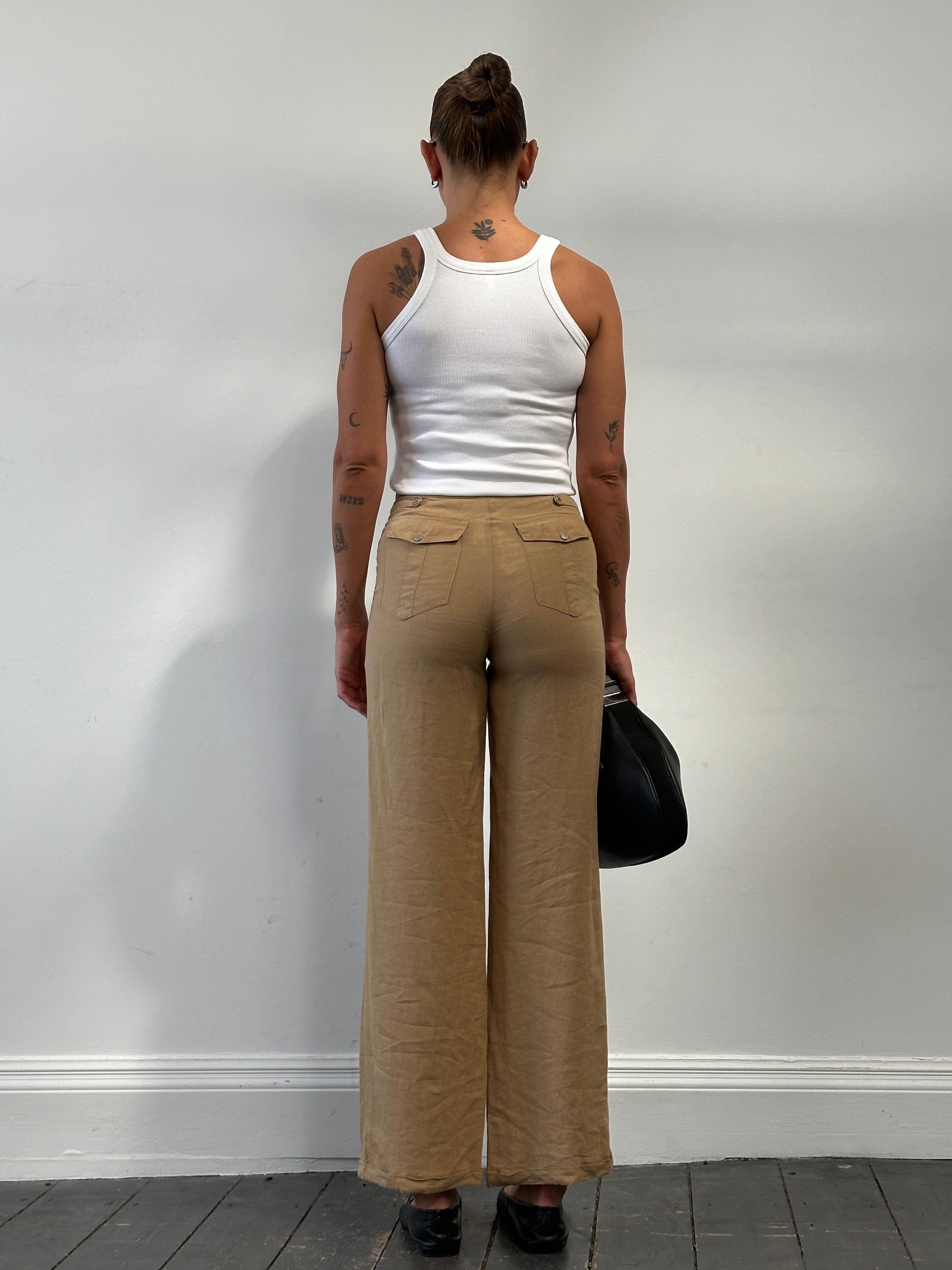 Vintage pure linen low waist wide leg trousers, size W26, shown in soft natural fabric with relaxed fit and wide leg silhouette.