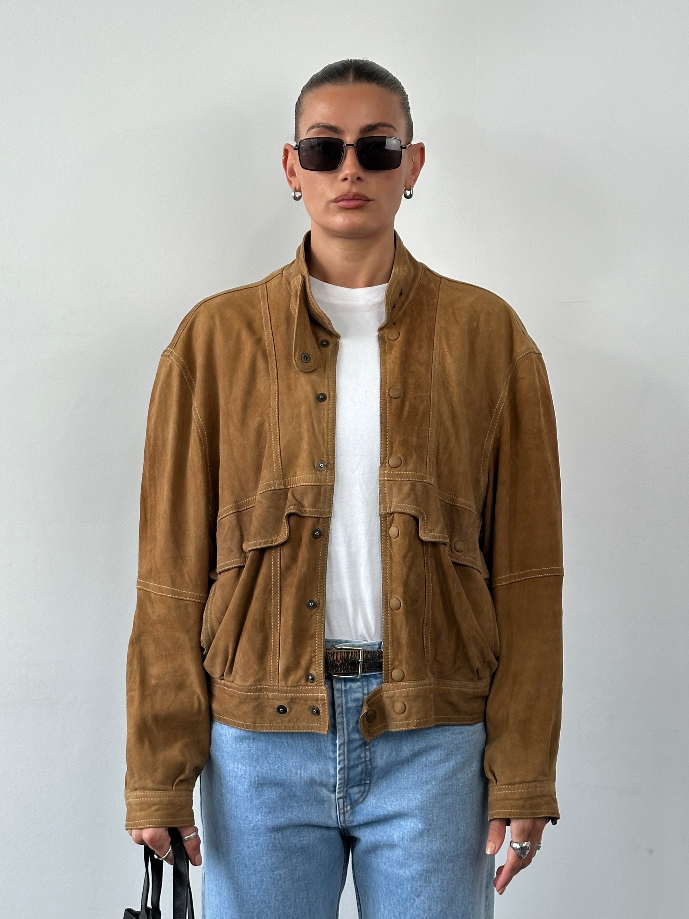 Vintage high neck suede bomber jacket in size M, featuring a classic design and soft brown suede material.
