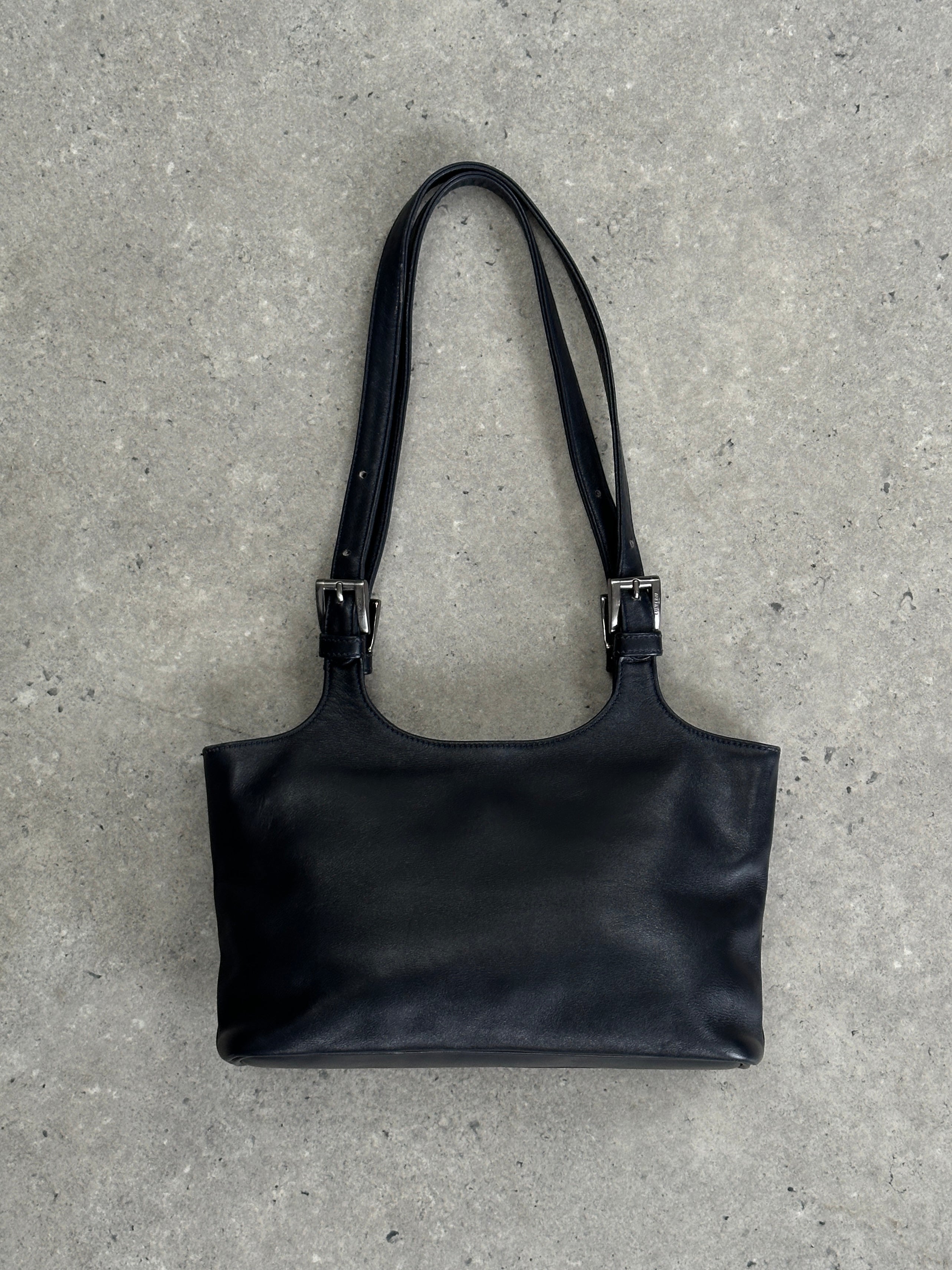 Vintage Italian leather buckle shoulder bag with adjustable strap and classic design, perfect for stylish everyday use.