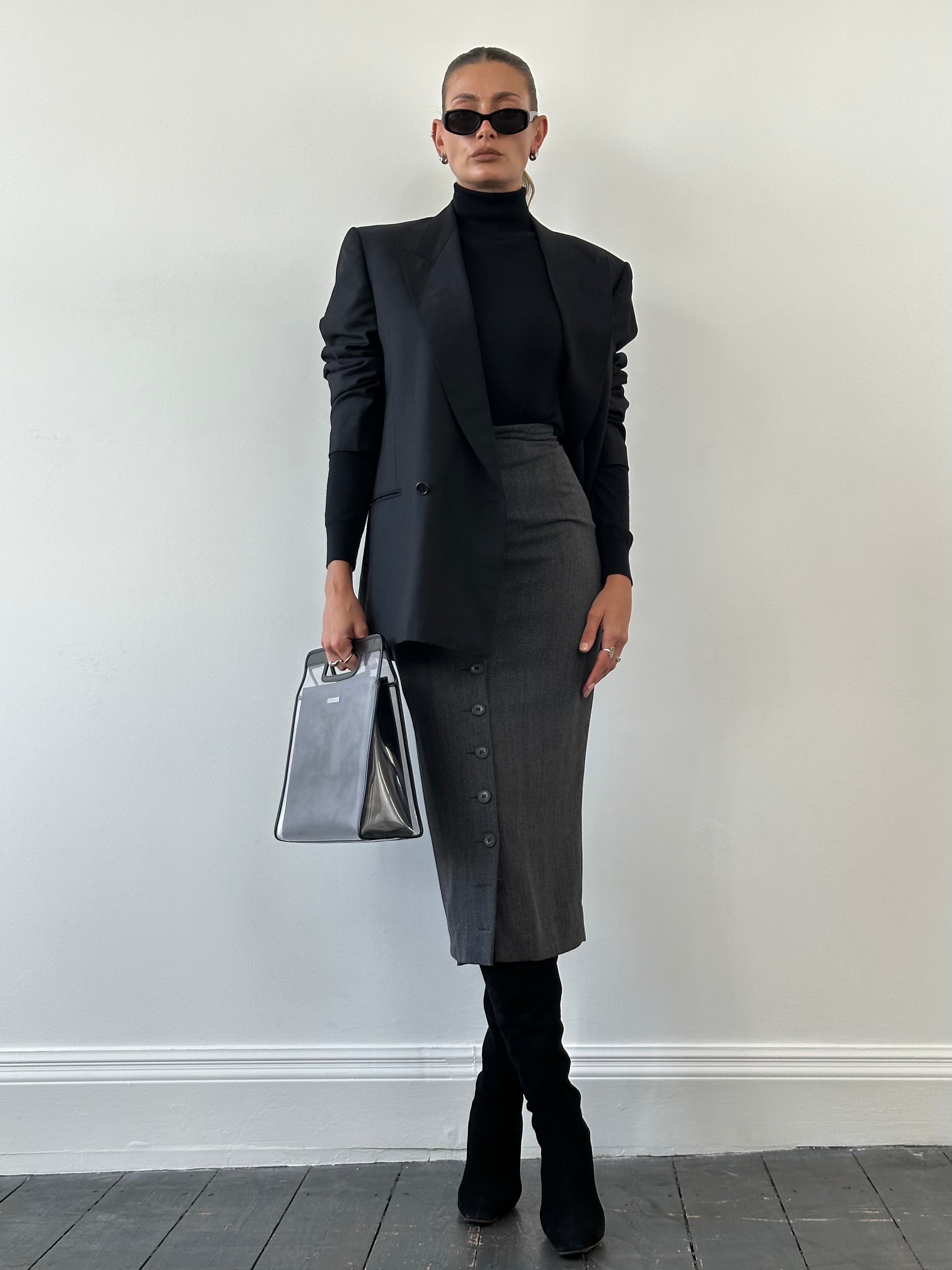 Vintage Italian vintage pure wool midi skirt, showcasing a classic design with a high waist and flowing silhouette.
