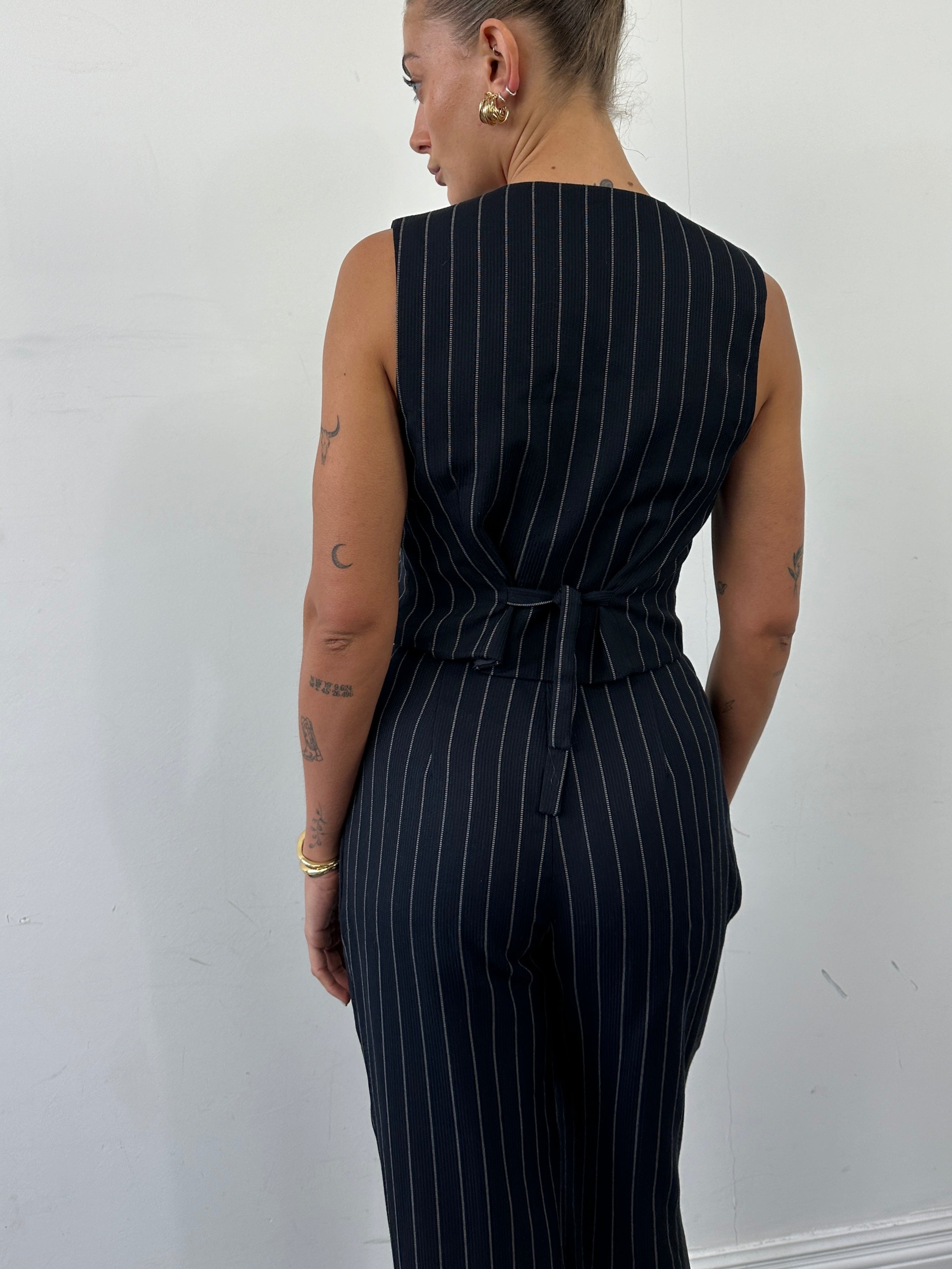Vintage British vintage pinstripe two-piece waistcoat and trousers set, size M, classic tailored suit for formal or vintage-inspired looks.