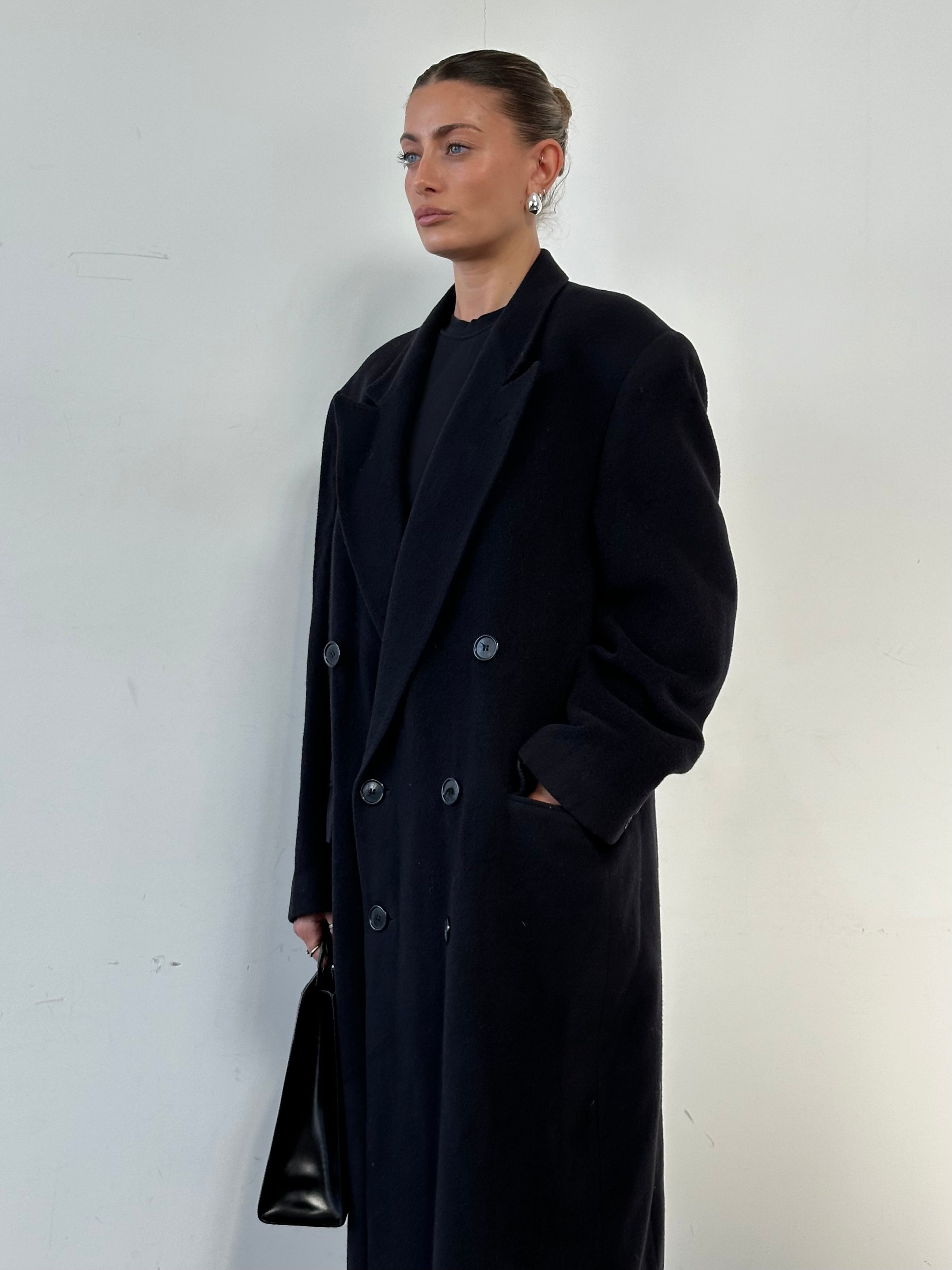 Yves Saint Laurent wool alpaca double-breasted coat in XL, shown on a hanger with classic lapel and button details.